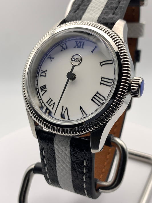 Thereabouts - One hand watch. 38mm coin edged stainless steel case. Enamel dial. Boxed K-1 crystal. Exhibition case back with blue custom rotor. Seiko NH38.