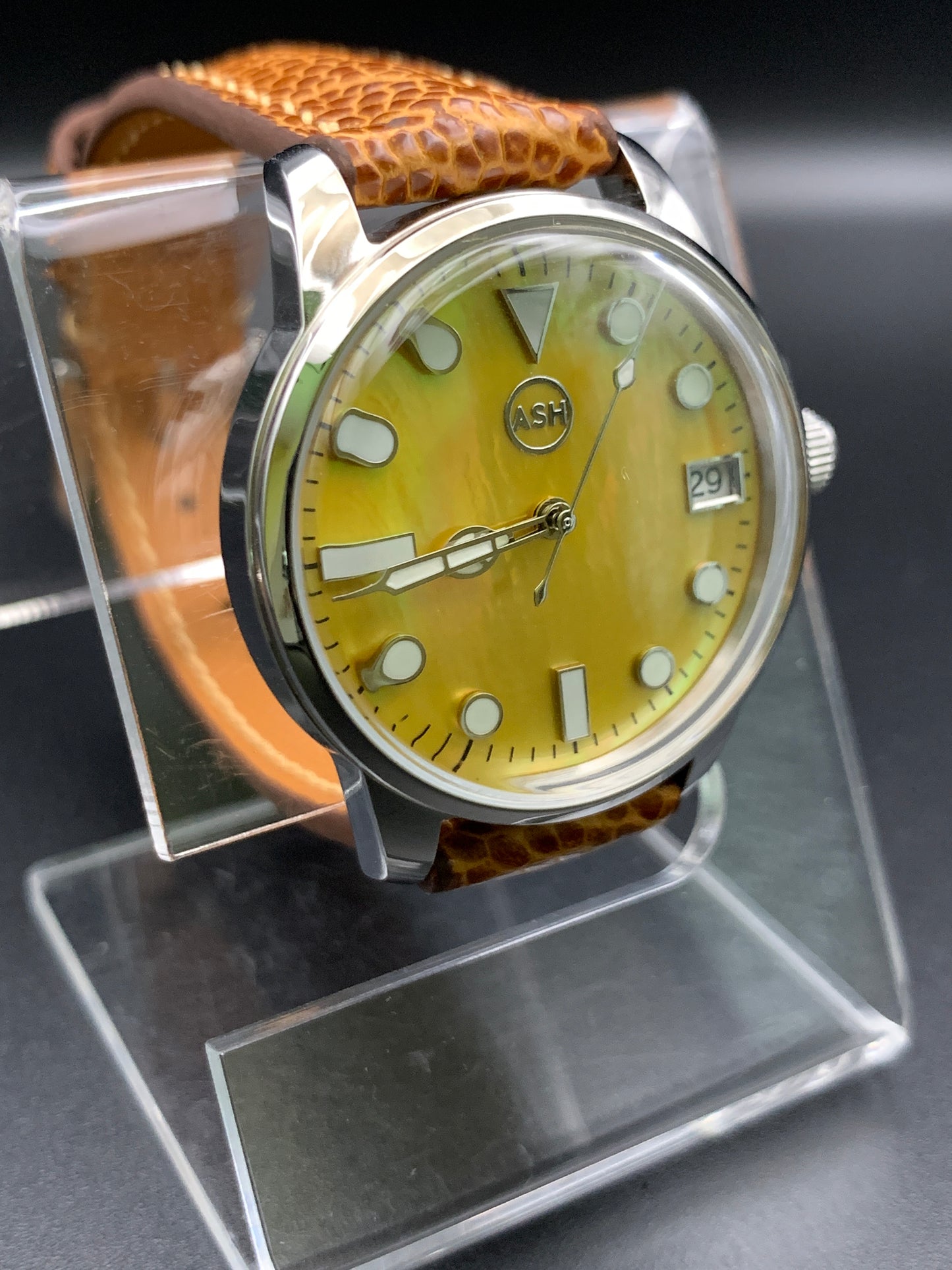 33mm Golden mother of pearl dress watch. Ostrich leather strap.