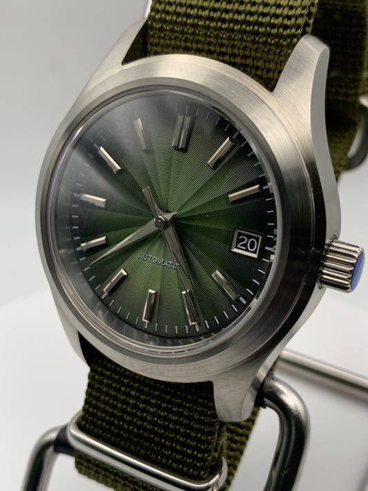 Fangorn 1.3 - 39mm brushed stainless steel. Sapphire crystal. Textured dial. Seiko NH35 with black date dial.