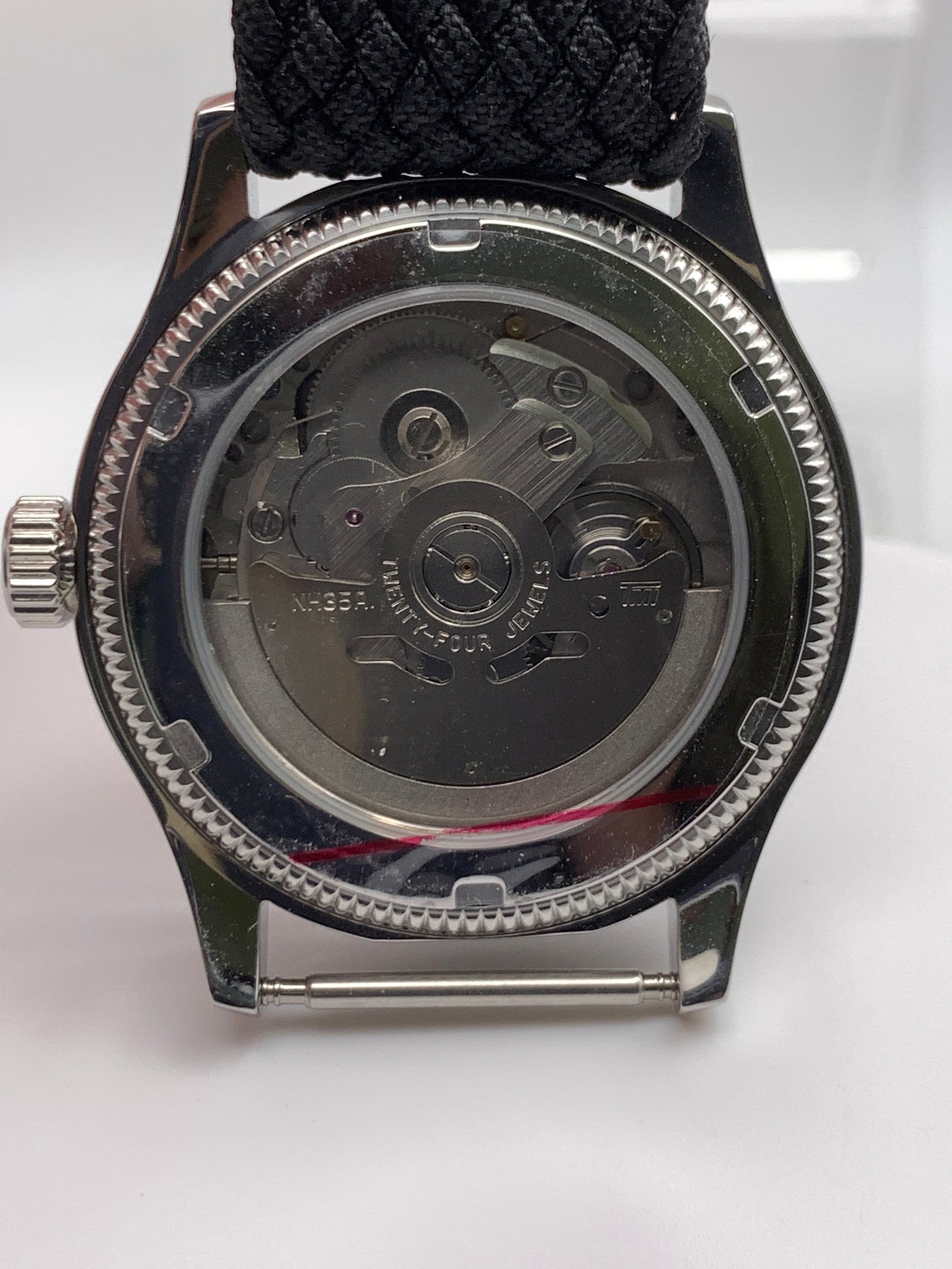 Homesick. 39mm Coin edged stainless steel case. Tobacco sunburst figured dial. AR coated domed mineral glass crystal. Seiko NH35 automatic movement.