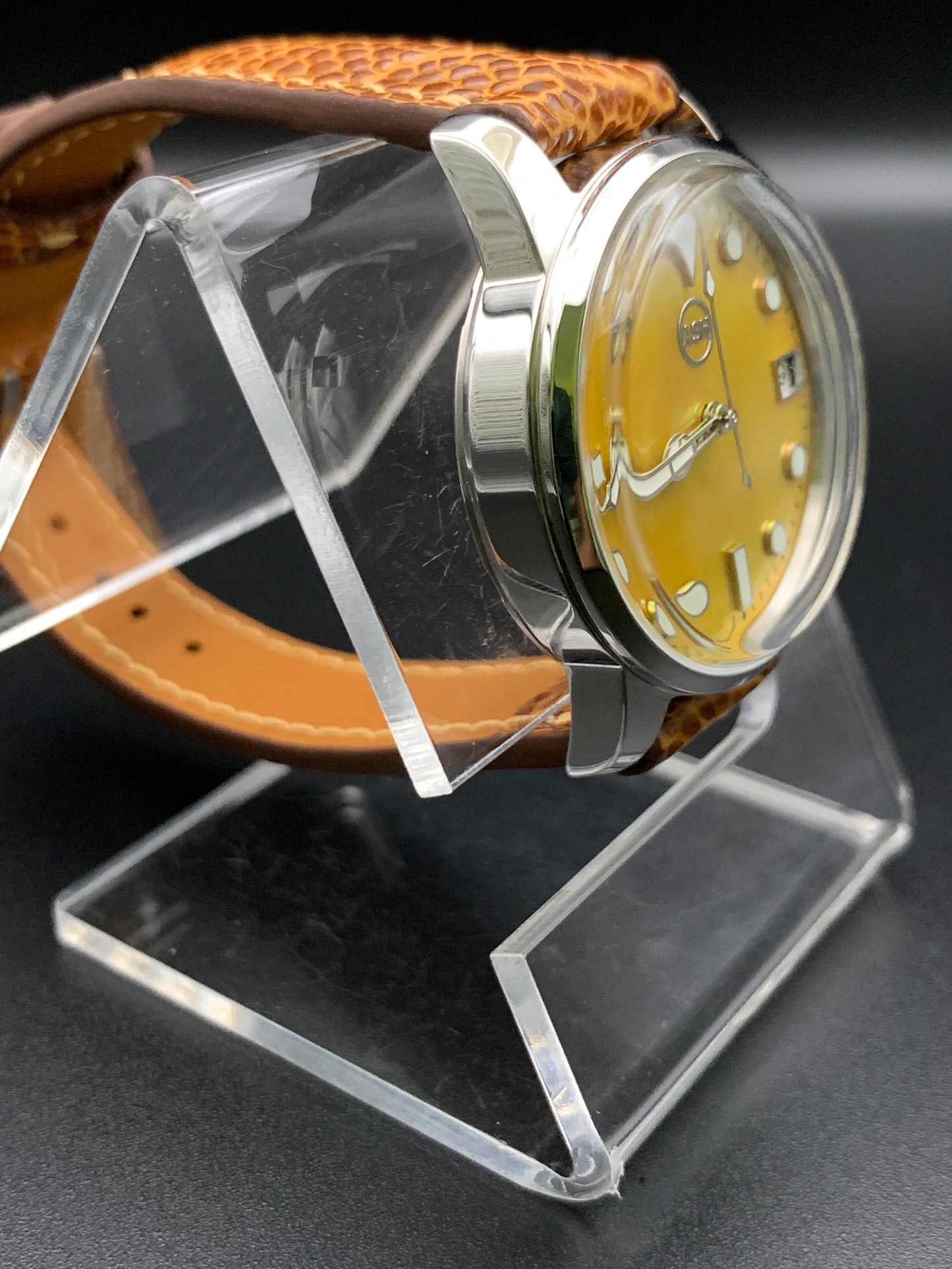 33mm Golden mother of pearl dress watch. Ostrich leather strap.
