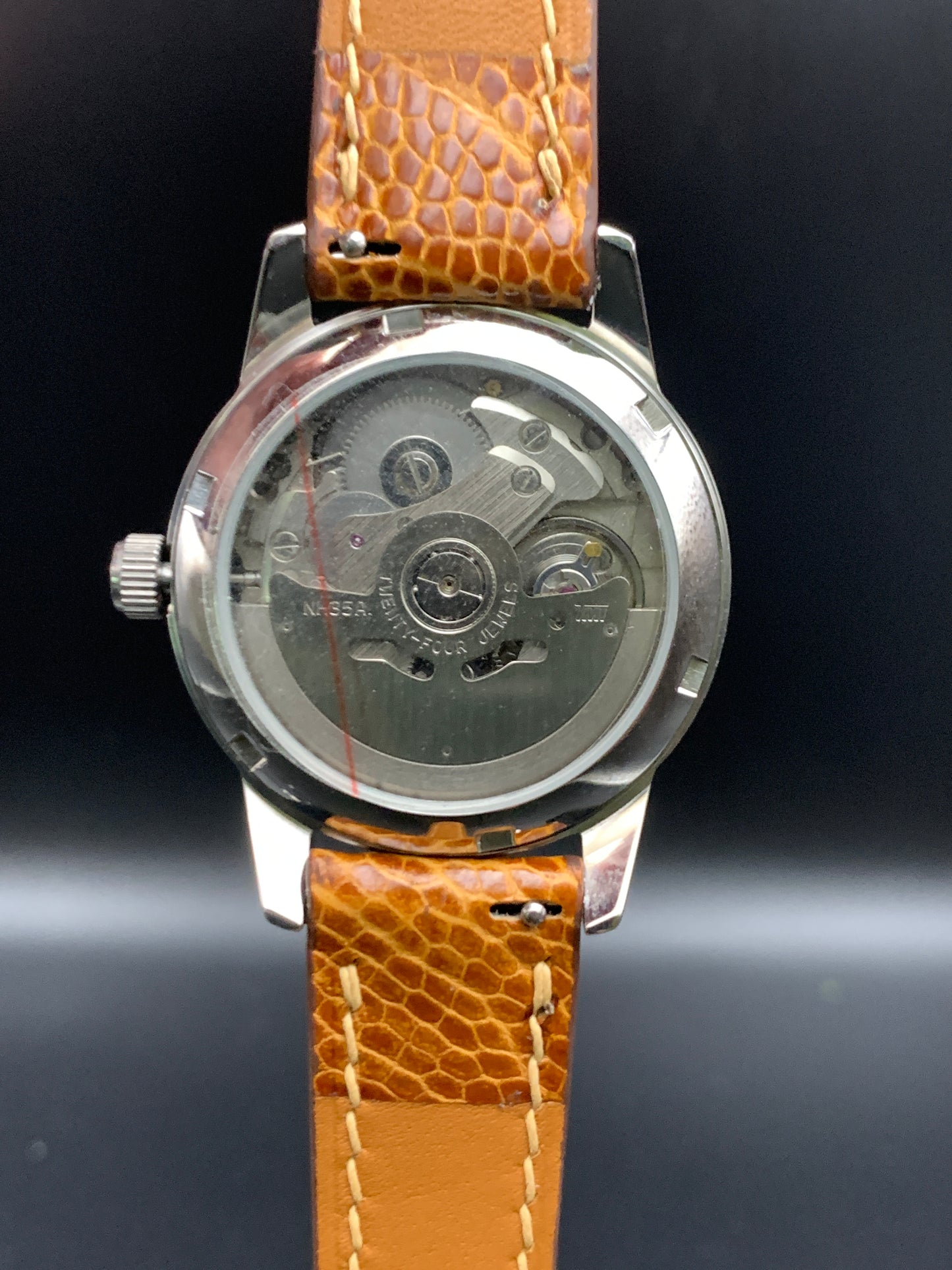 33mm Golden mother of pearl dress watch. Ostrich leather strap.