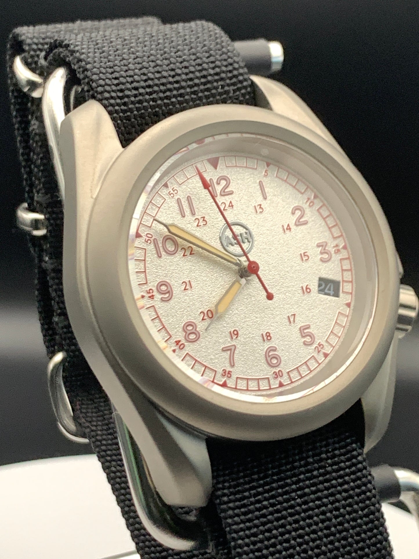 38mm Titanium Field Watch. Red and silver dial. Seiko NH35.