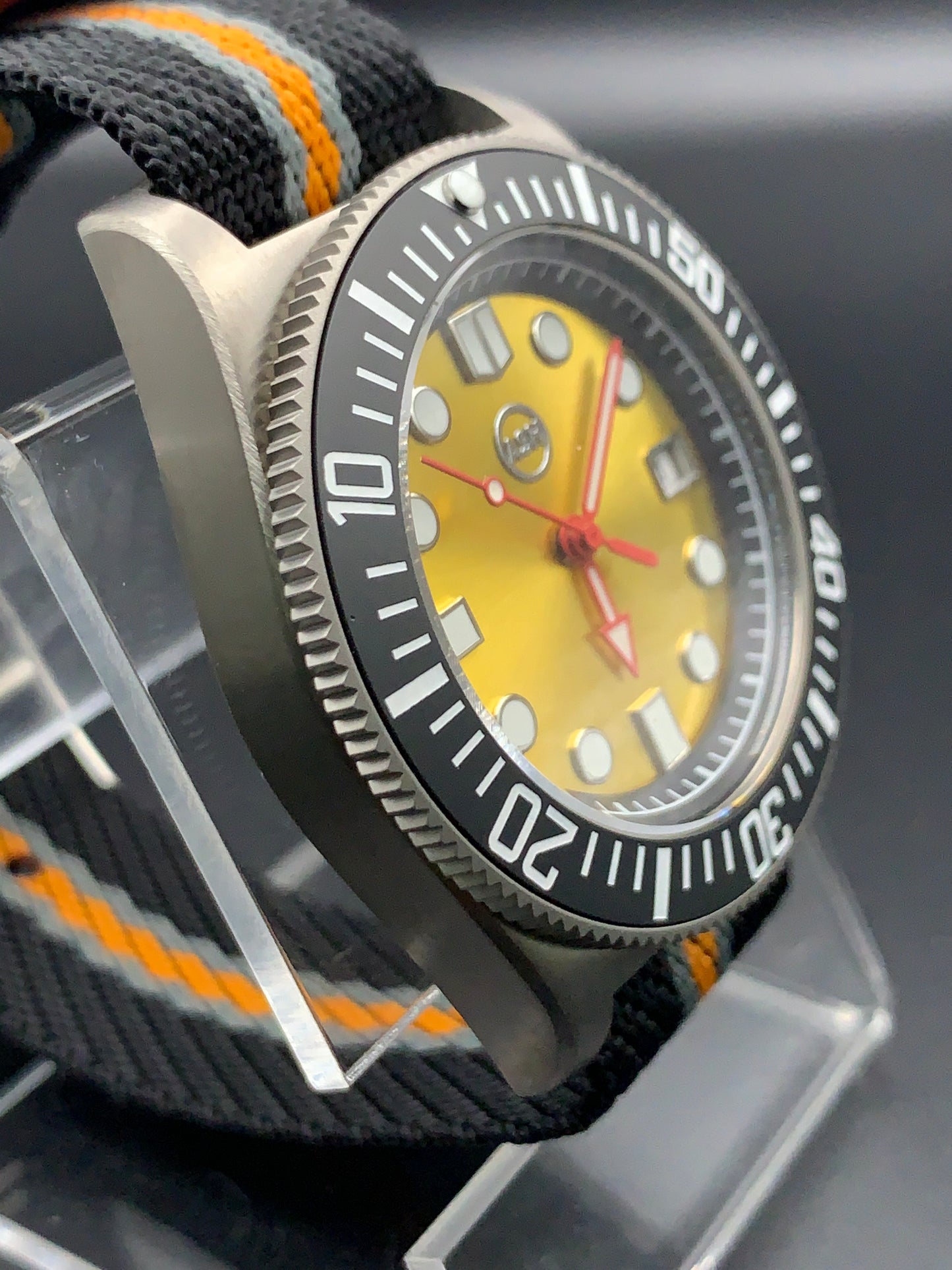 Titanium 42mm dive watch. Fixed lugs. Sapphire crystal. Seiko NH35. 200m water resistance.