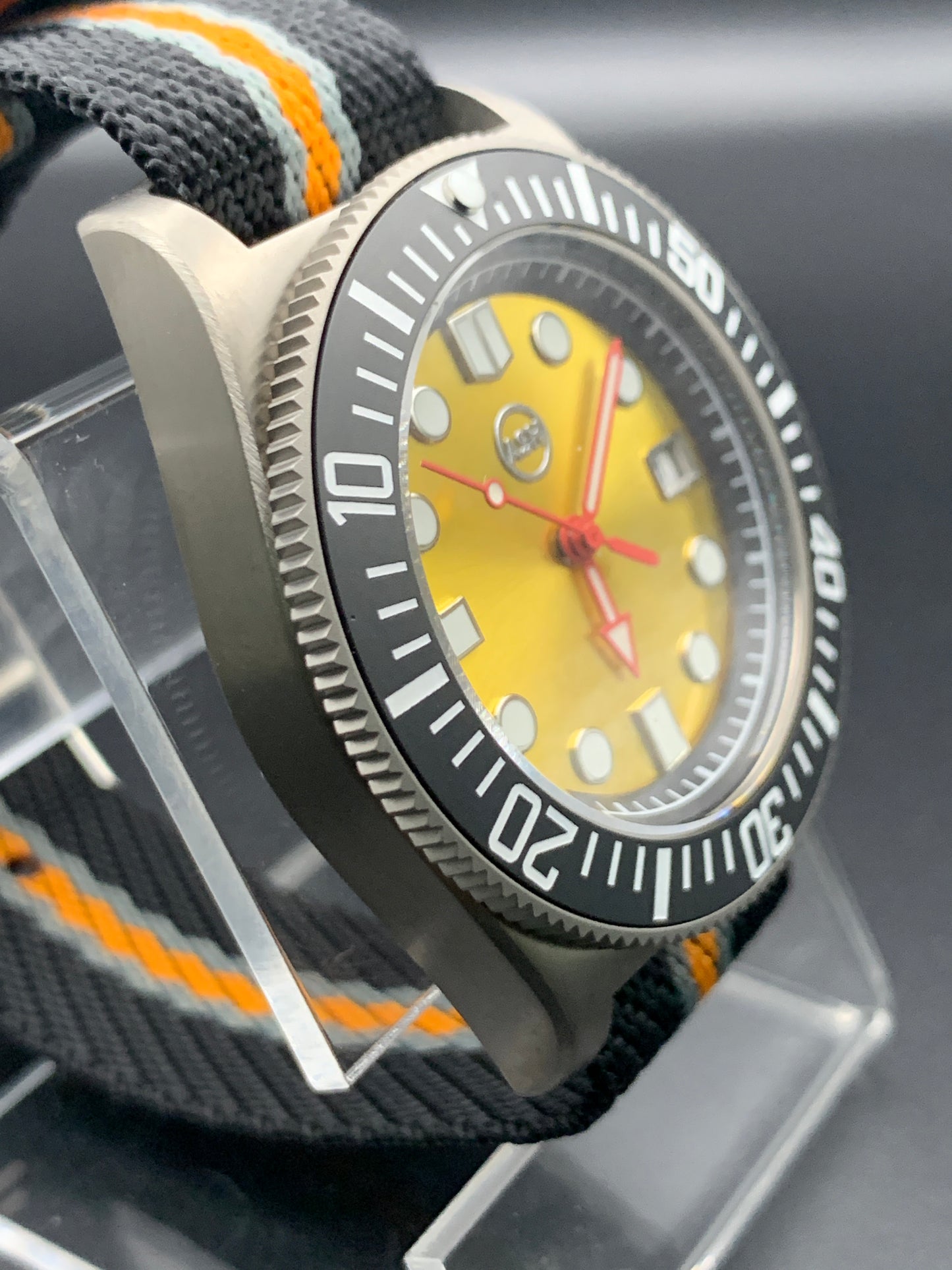 Titanium 42mm dive watch. Fixed lugs. Sapphire crystal. Seiko NH35. 200m water resistance.