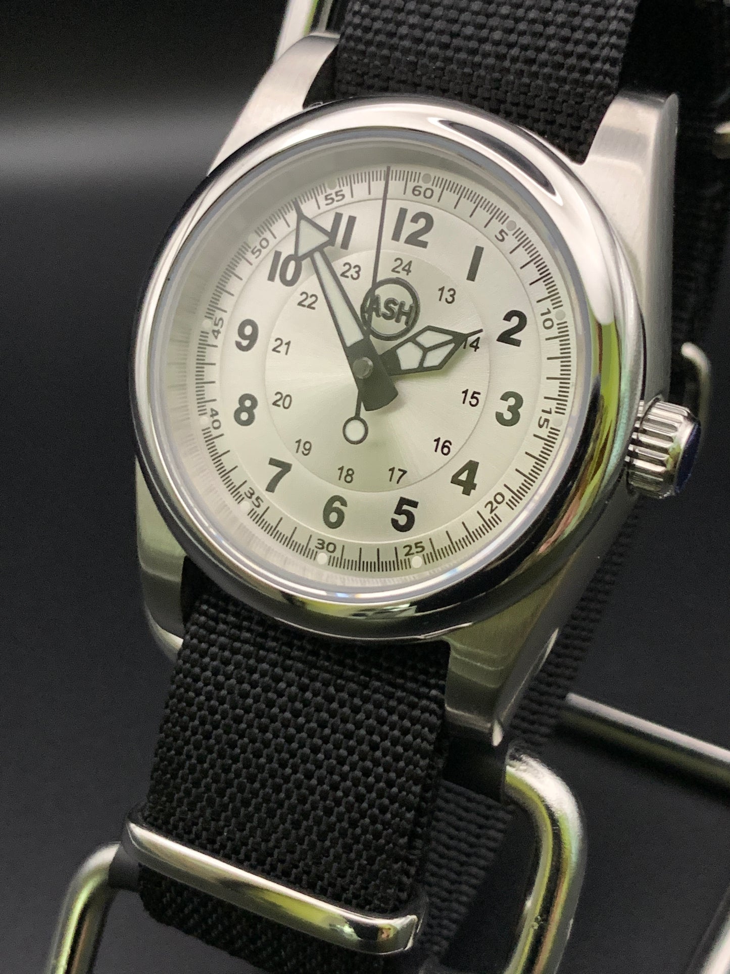Silver sunray and black field watch. 36mm. Sapphire crystal. Seiko NH38.