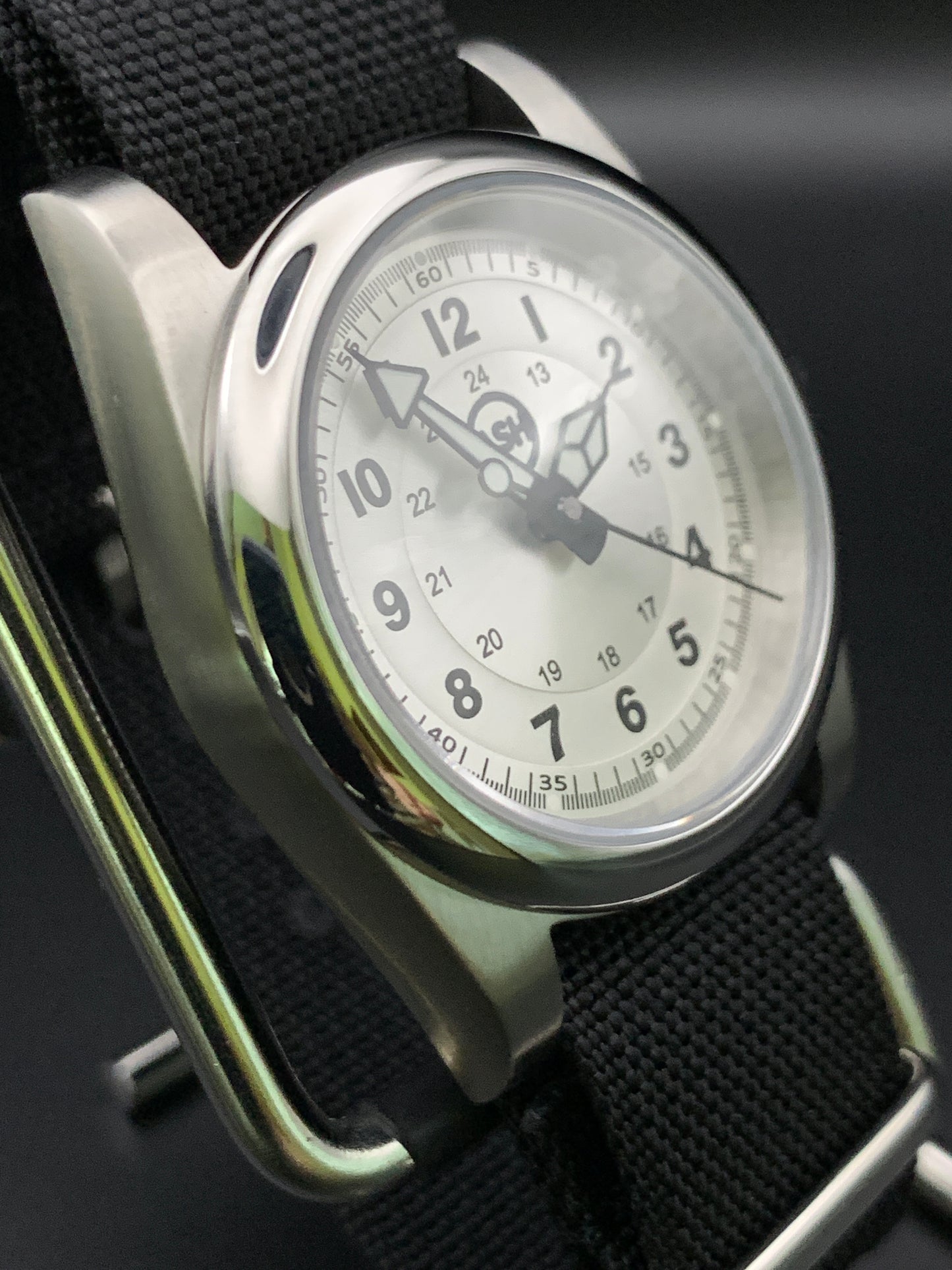 Silver sunray and black field watch. 36mm. Sapphire crystal. Seiko NH38.