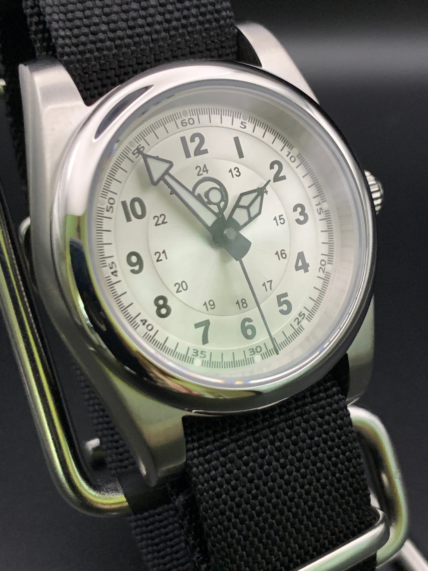 Silver sunray and black field watch. 36mm. Sapphire crystal. Seiko NH38.