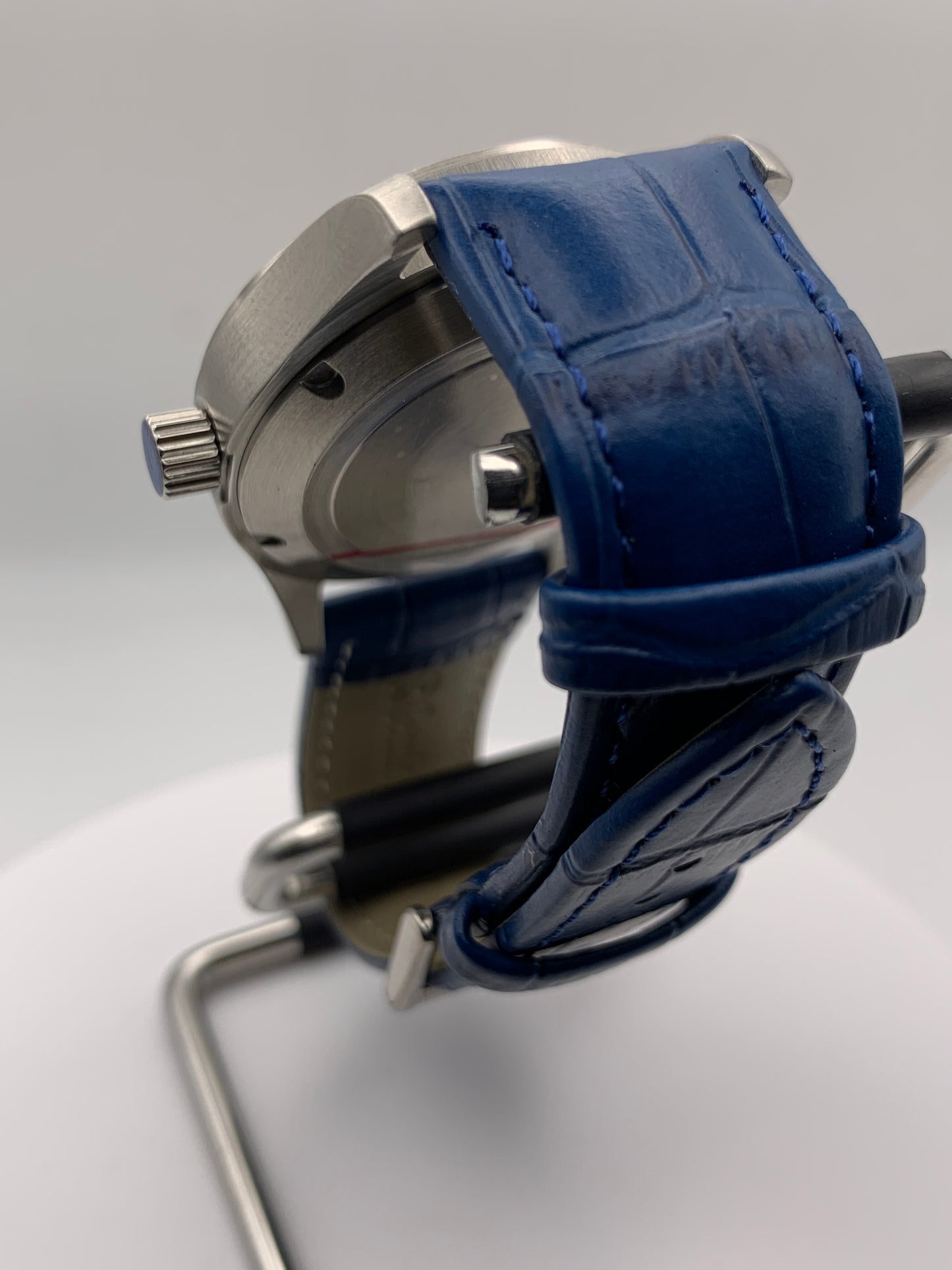 Wintermute. 39mm brushed stainless steel case. Domed sapphire crystal. Seiko NH35 with blue date wheel.