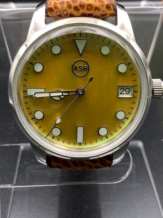 33mm Golden mother of pearl dress watch. Ostrich leather strap.