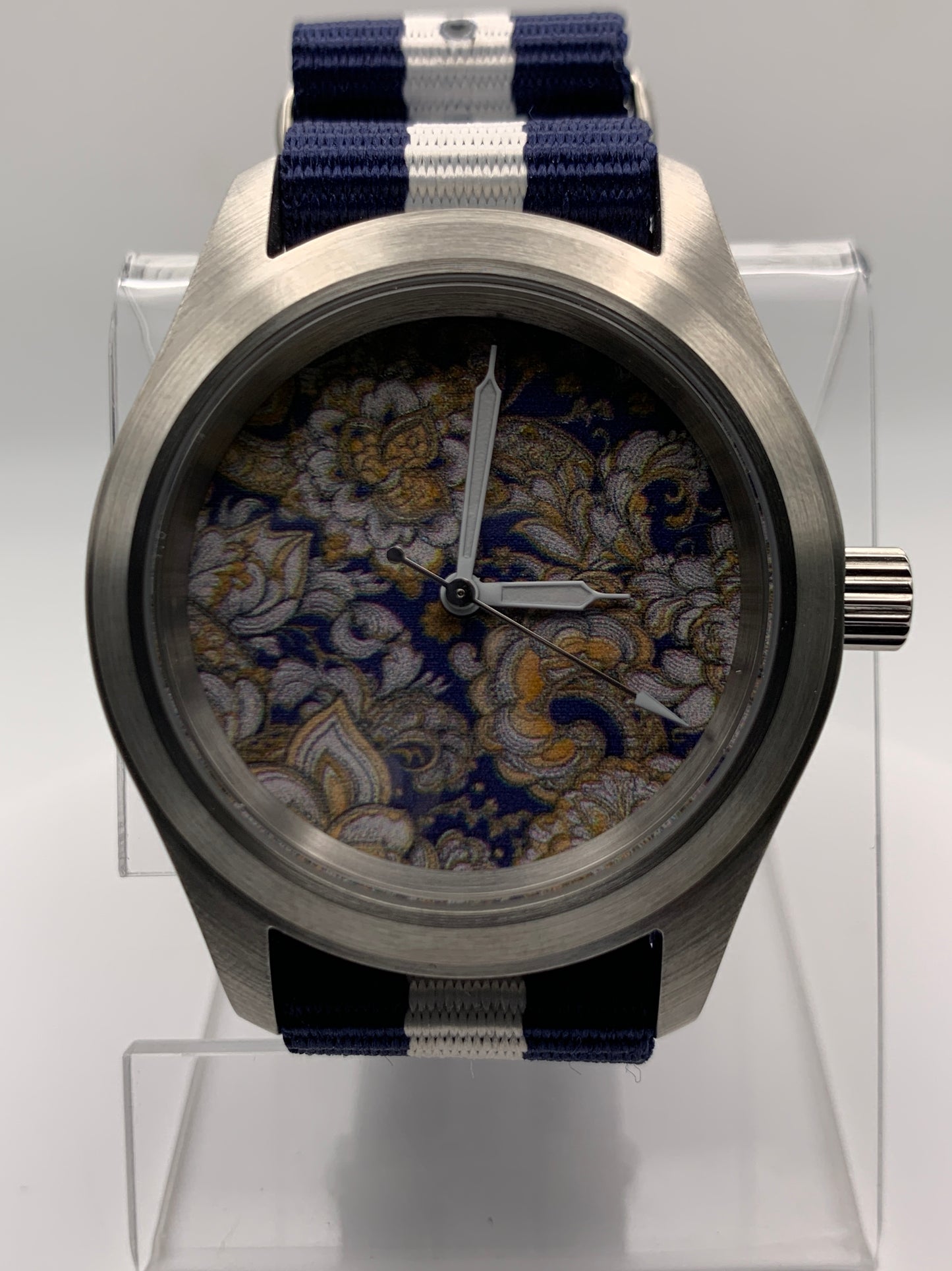 Cloth & Steel. 38mm brushed stainless steel. Ornate dial. Sapphire crystal. Seiko NH38