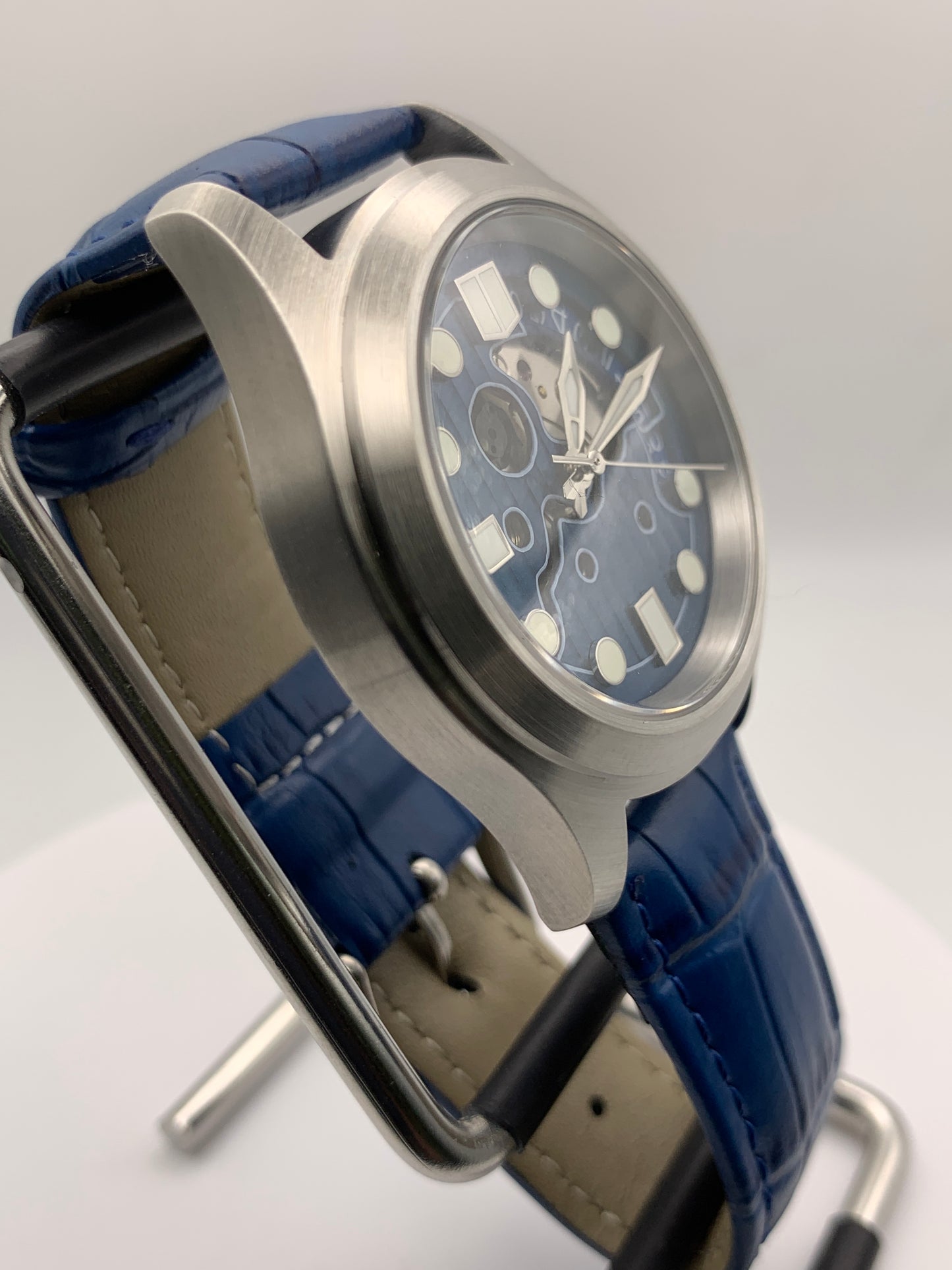 Wintermute. 39mm brushed stainless steel case. Domed sapphire crystal. Seiko NH35 with blue date wheel.