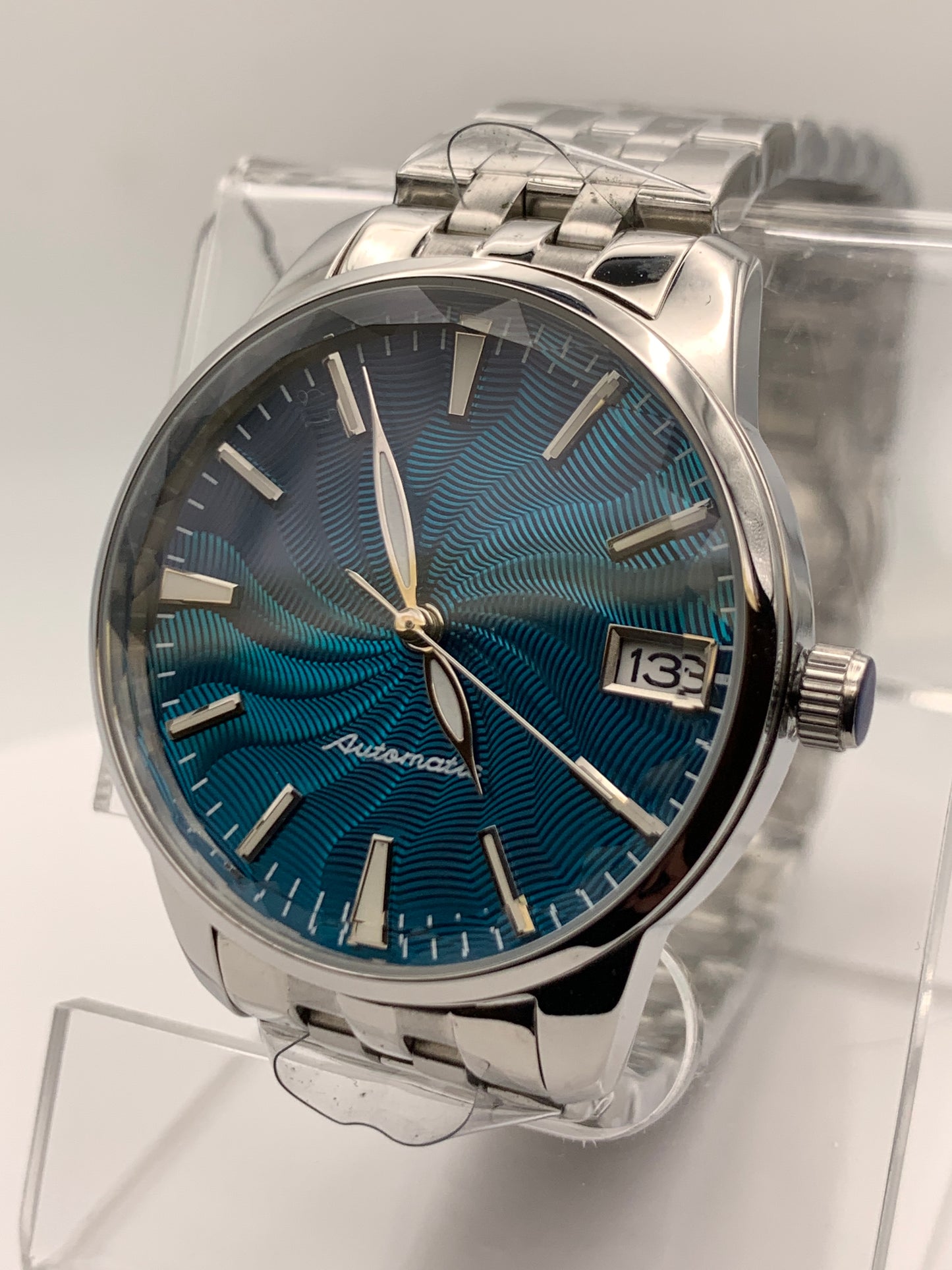 The Teal. Highly figured dress watch. 33mm stainless steel case. Faceted and domed acrylic crystal. NH35.
