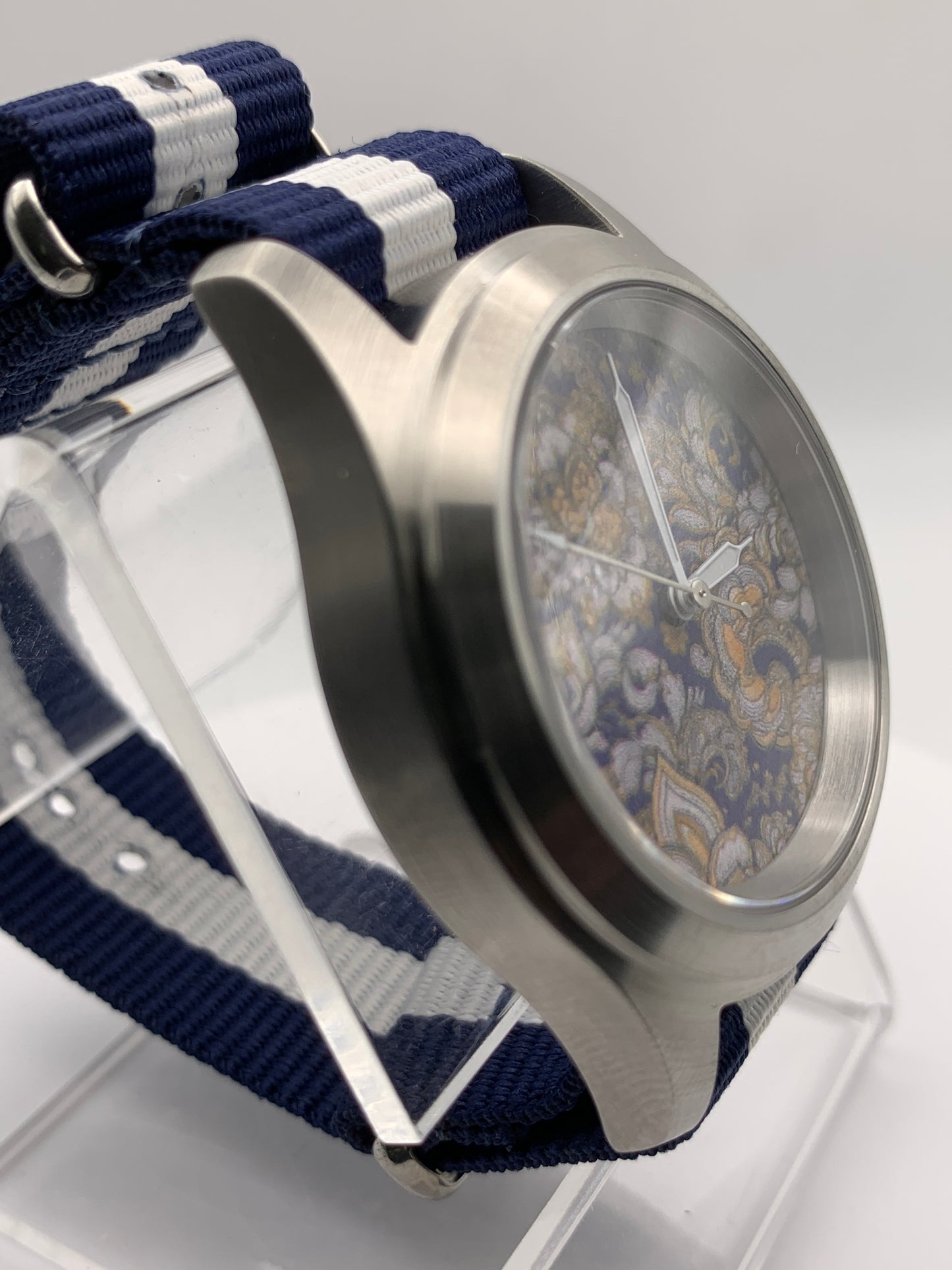 Cloth & Steel. 38mm brushed stainless steel. Ornate dial. Sapphire crystal. Seiko NH38