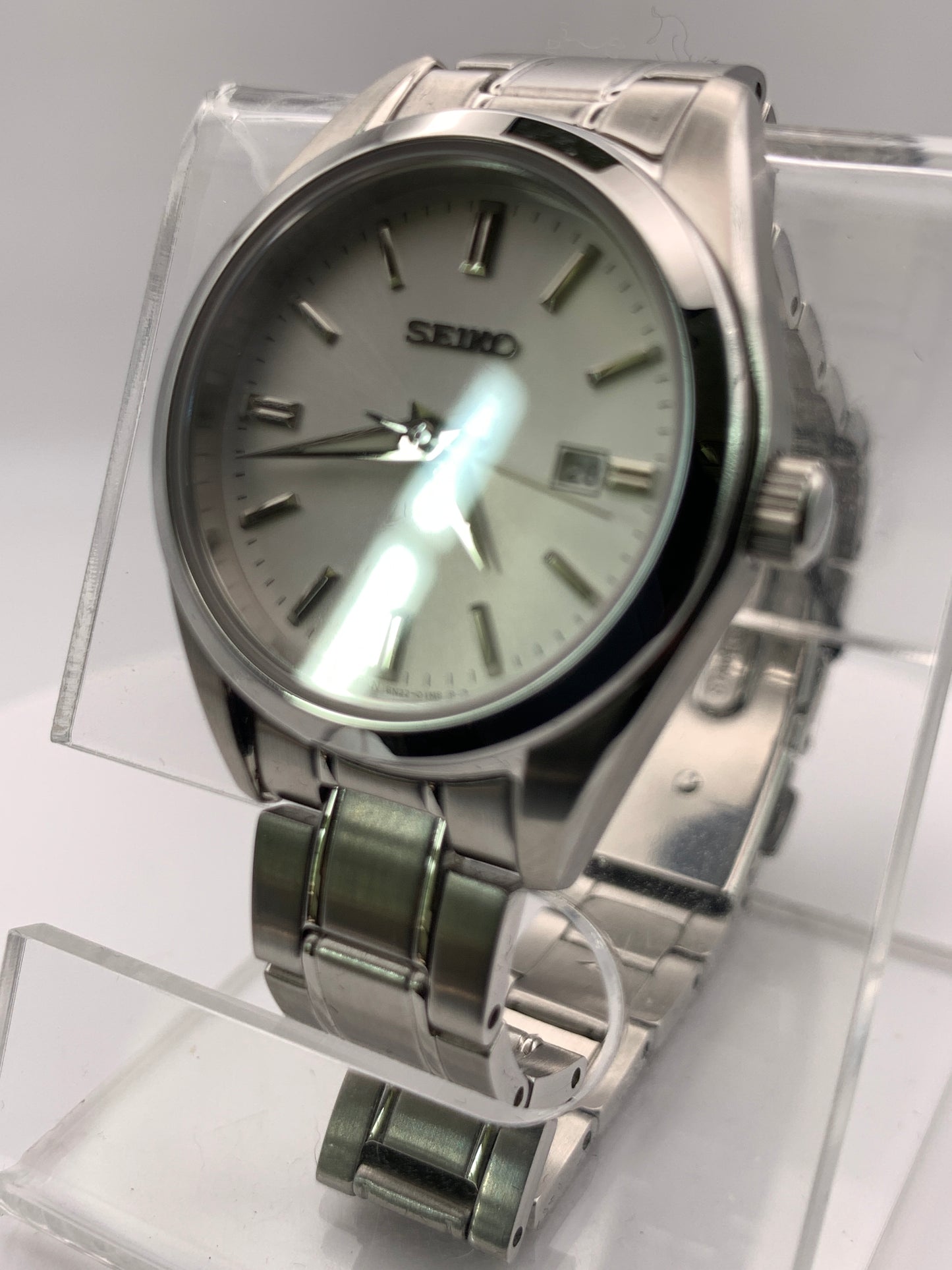 Seiko SUR633- 30mm Stainless steel case. Silver sunray dial. Sapphire crystal. 6n22 quartz movement. 100m water resistance. Box and papers.