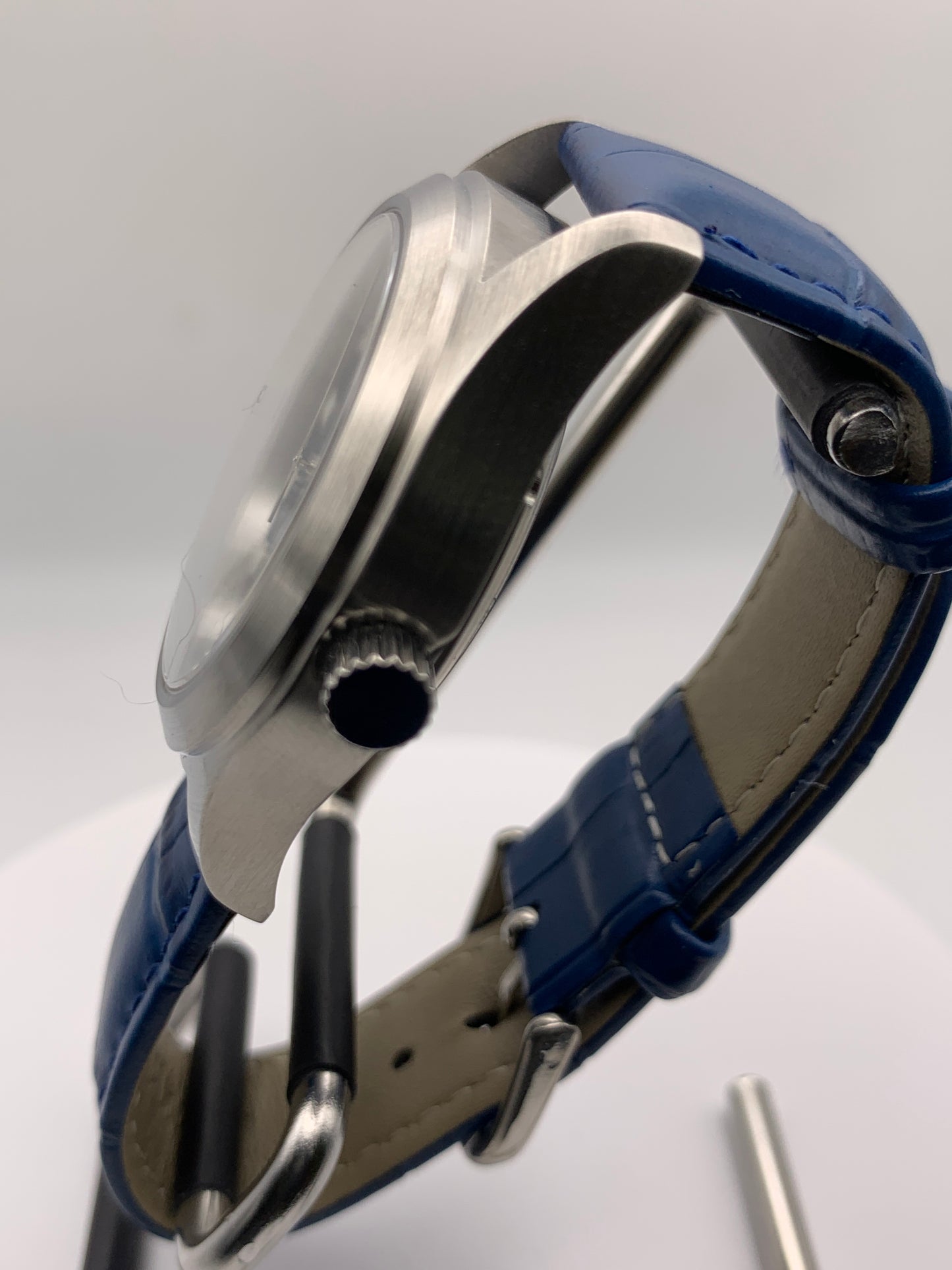 Wintermute. 39mm brushed stainless steel case. Domed sapphire crystal. Seiko NH35 with blue date wheel.