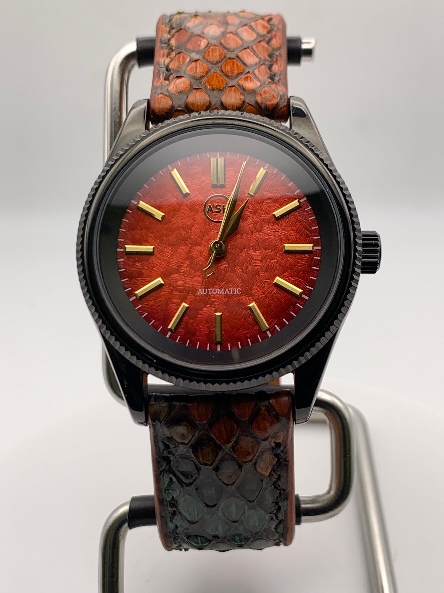 Ecthelion. Golden fire livery. 39mm fluted, PVD coated, stainless steel case. Sapphire crystal. Seiko NH38. Dragon scale strap. Mystical powers.