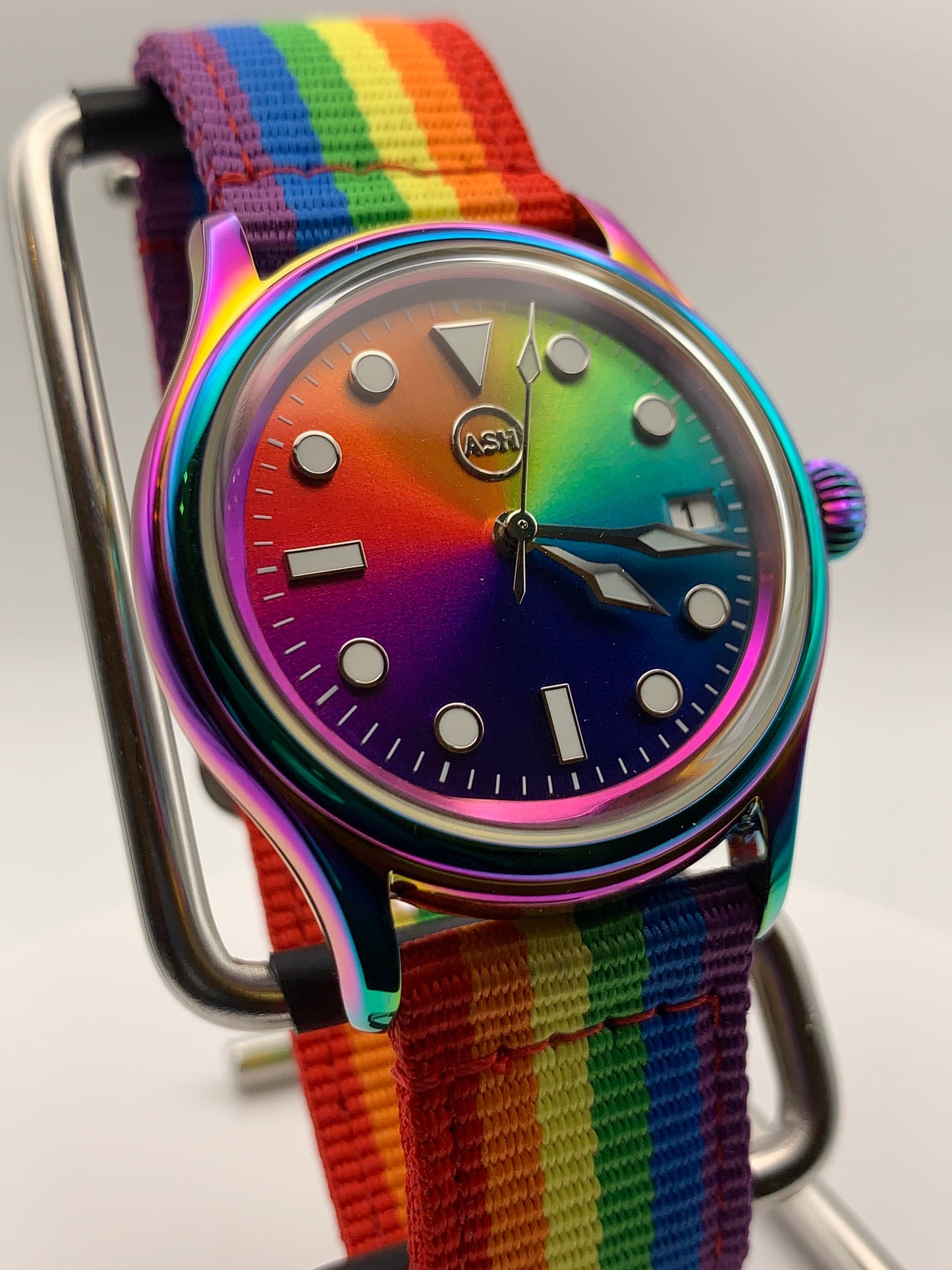 Portable rainbow. 38mm thermally colored stainless steel case and case back. Double dome K-1 mineral crystal. Seiko NH35.
