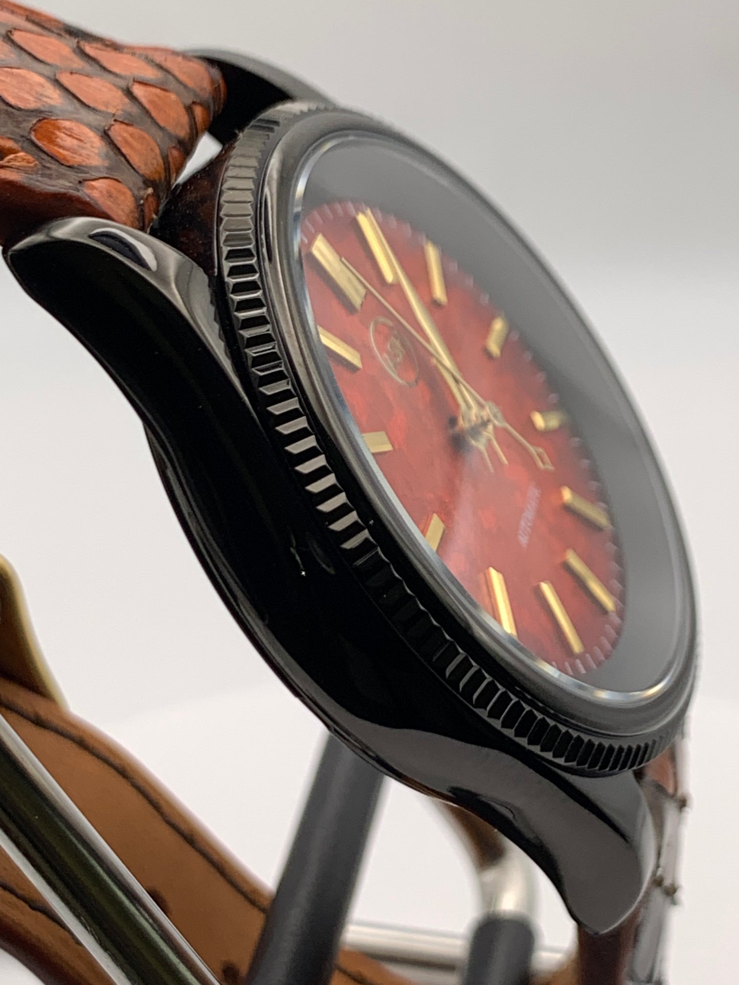 Ecthelion. Golden fire livery. 39mm fluted, PVD coated, stainless steel case. Sapphire crystal. Seiko NH38. Dragon scale strap. Mystical powers.
