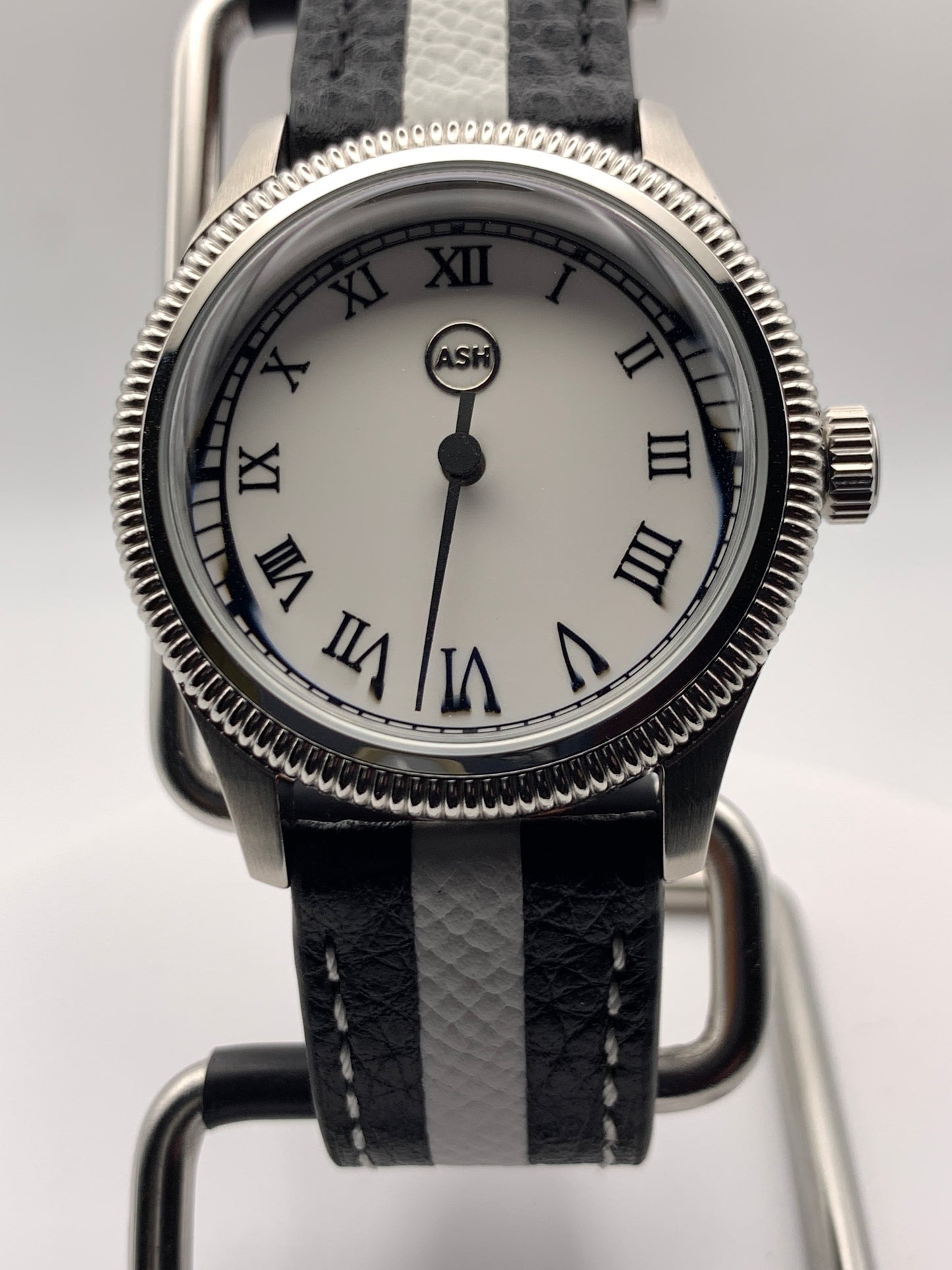 Thereabouts - One hand watch. 38mm coin edged stainless steel case. Enamel dial. Boxed K-1 crystal. Exhibition case back with blue custom rotor. Seiko NH38.
