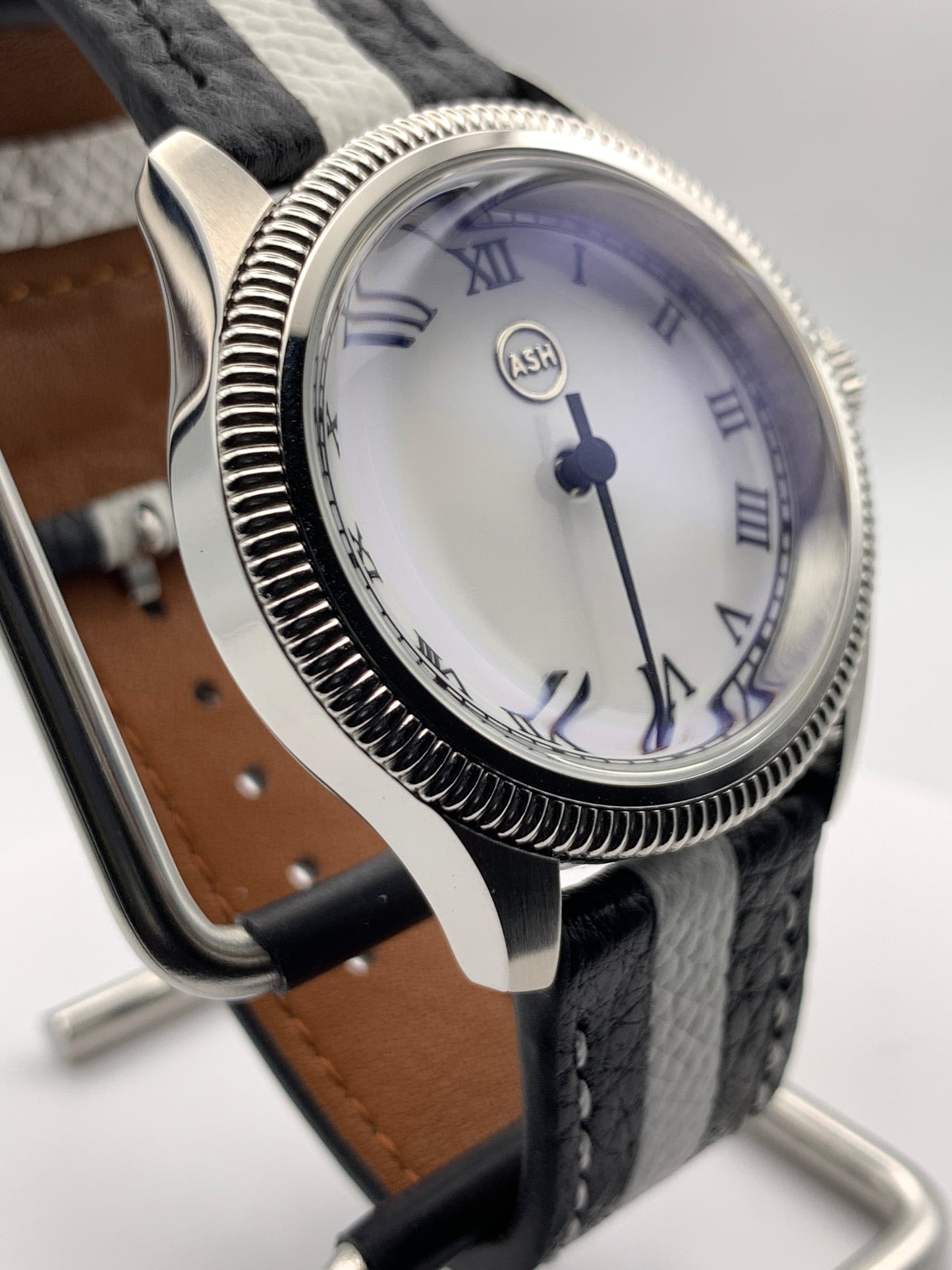 Thereabouts - One hand watch. 38mm coin edged stainless steel case. Enamel dial. Boxed K-1 crystal. Exhibition case back with blue custom rotor. Seiko NH38.