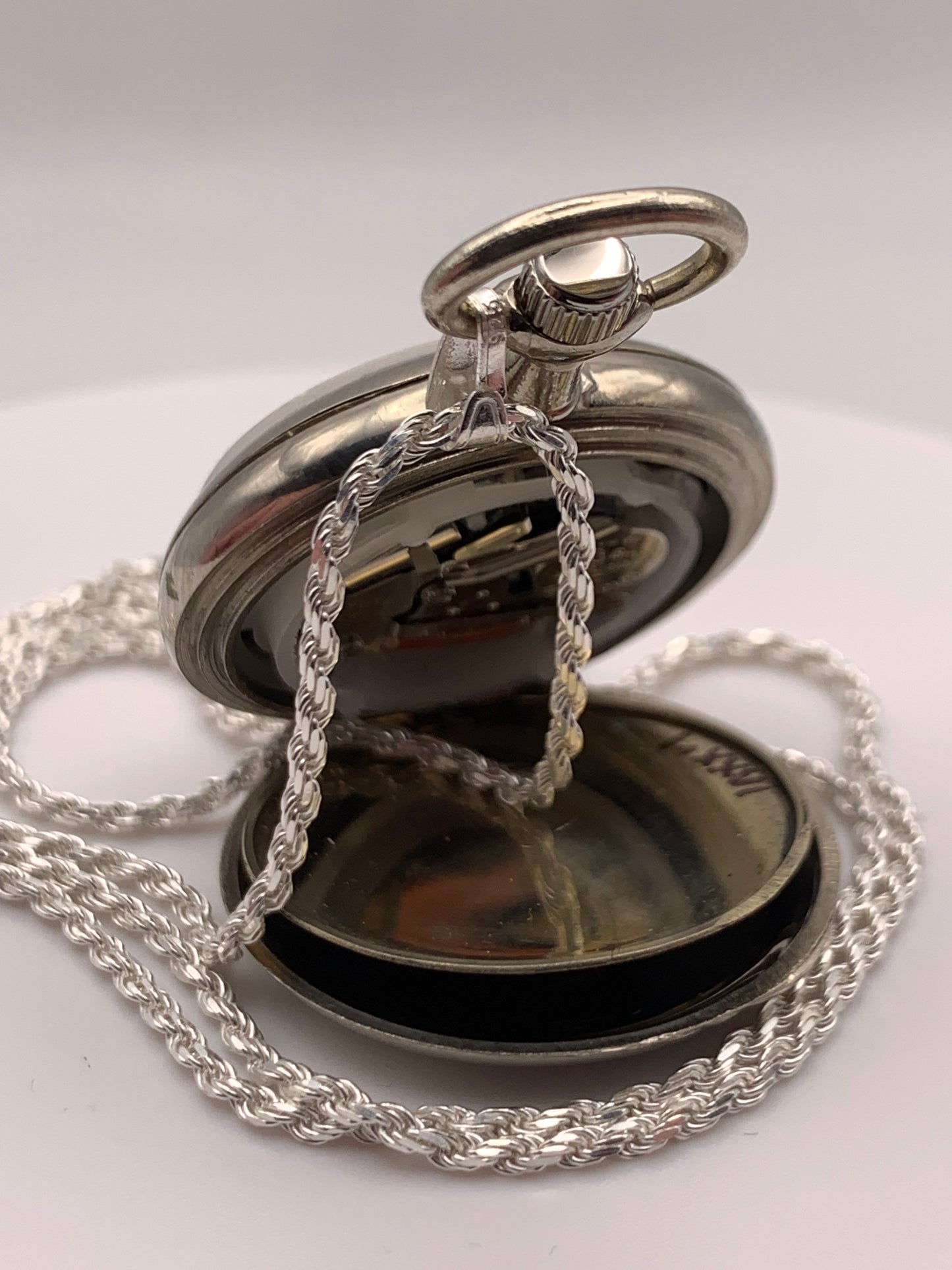 Amuse-bouche Deux. 30mm NOS Argentan alloy pocket / necklace watch. On a 24” 1.5mm sterling silver chain. Sapphire crystal. Vintage hand painted enamel dial. Miyota 2036.