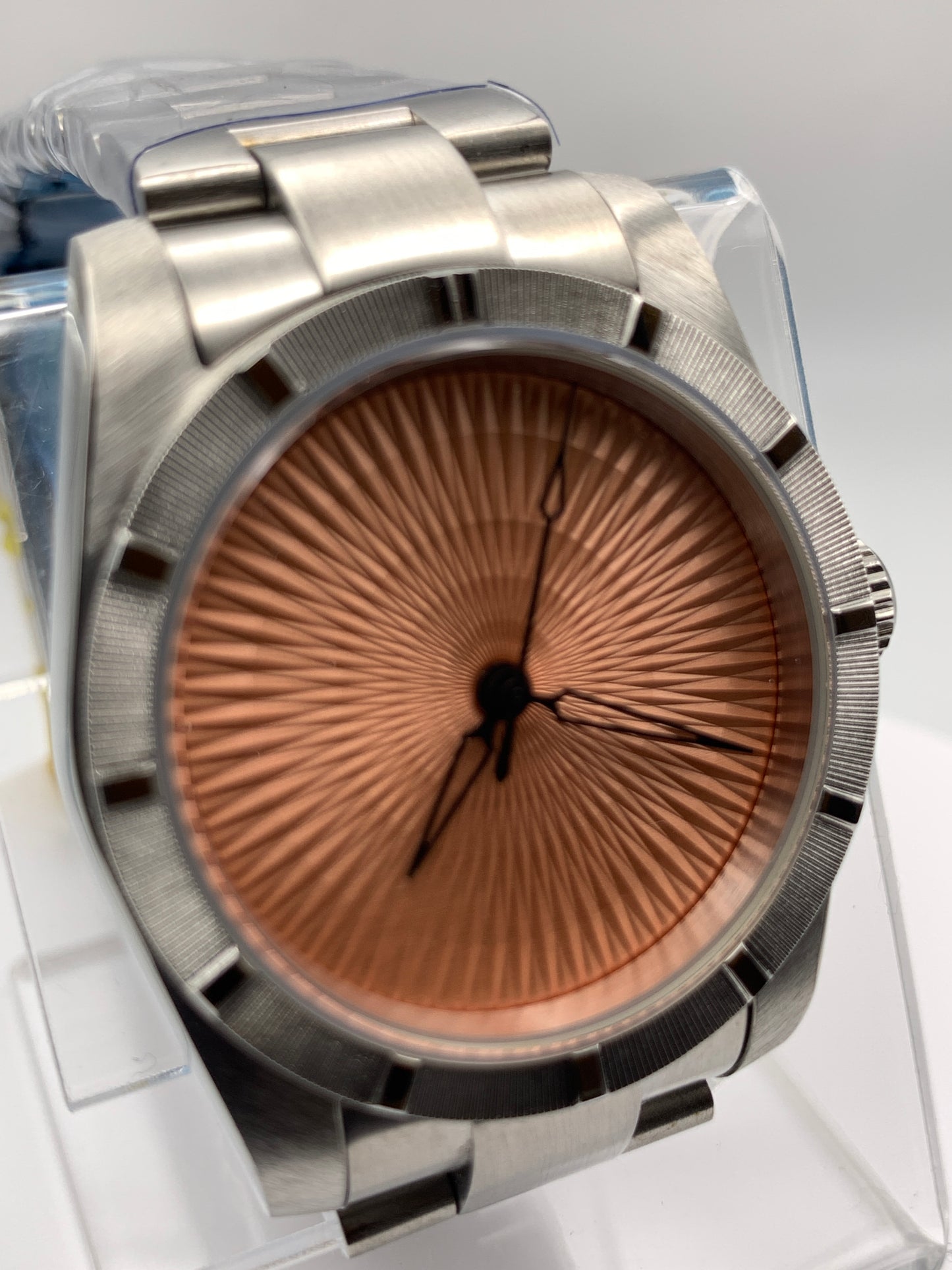 Sunbeam. 39mm stainless steel case and matching bracelet. Textured dial and unique handset. Sapphire crystal. NH38 automatic movement.