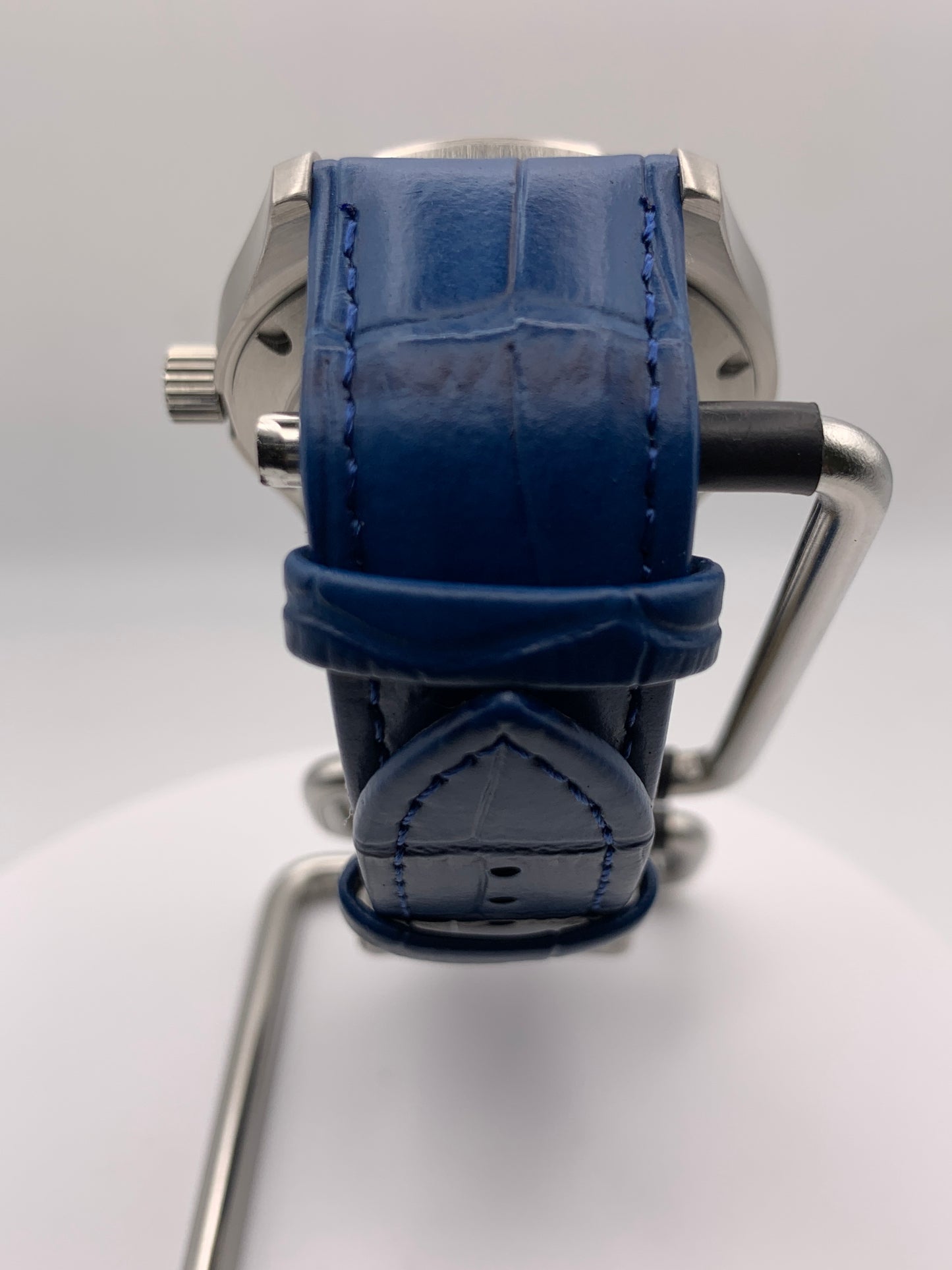 Wintermute. 39mm brushed stainless steel case. Domed sapphire crystal. Seiko NH35 with blue date wheel.
