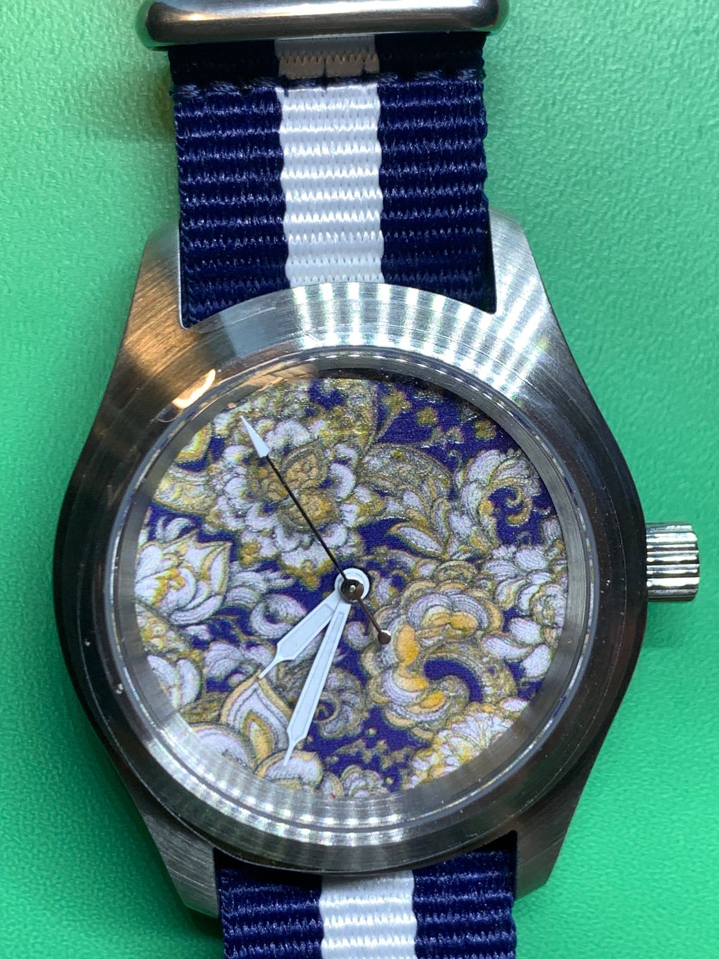 Cloth & Steel. 38mm brushed stainless steel. Ornate dial. Sapphire crystal. Seiko NH38