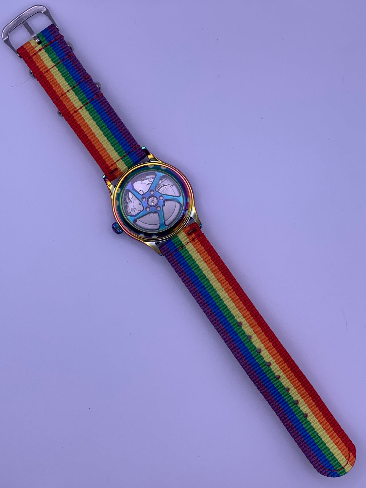 Portable rainbow. 38mm thermally colored stainless steel case and case back. Double dome K-1 mineral crystal. Seiko NH35.