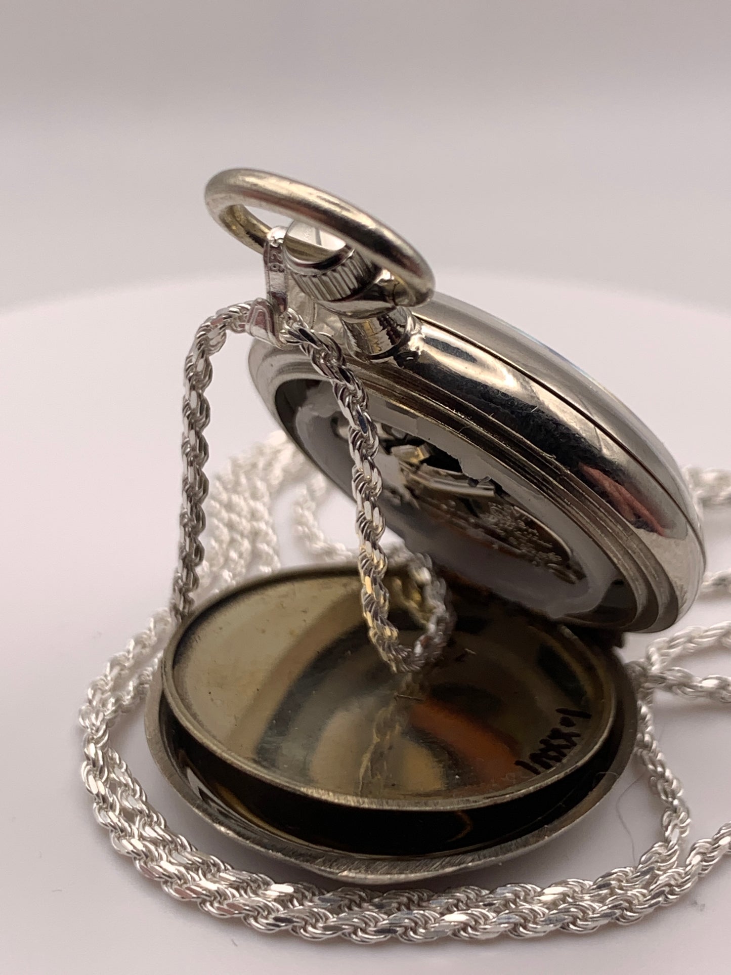 Amuse-bouche Deux. 30mm NOS Argentan alloy pocket / necklace watch. On a 24” 1.5mm sterling silver chain. Sapphire crystal. Vintage hand painted enamel dial. Miyota 2036.