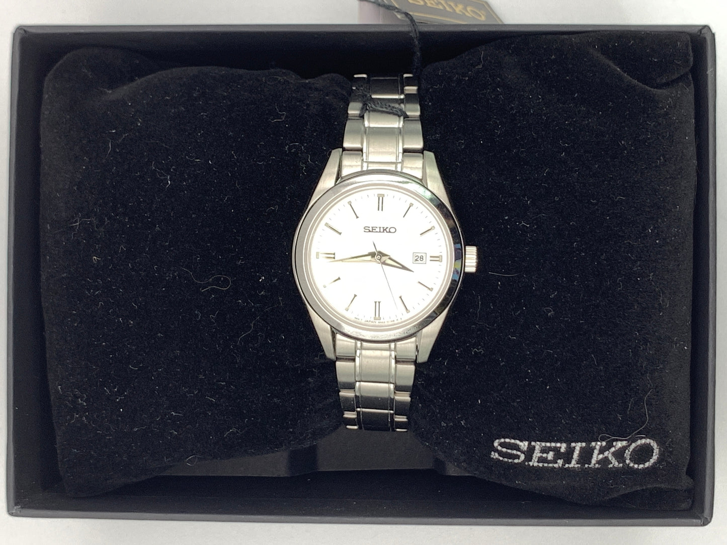 Seiko SUR633- 30mm Stainless steel case. Silver sunray dial. Sapphire crystal. 6n22 quartz movement. 100m water resistance. Box and papers.