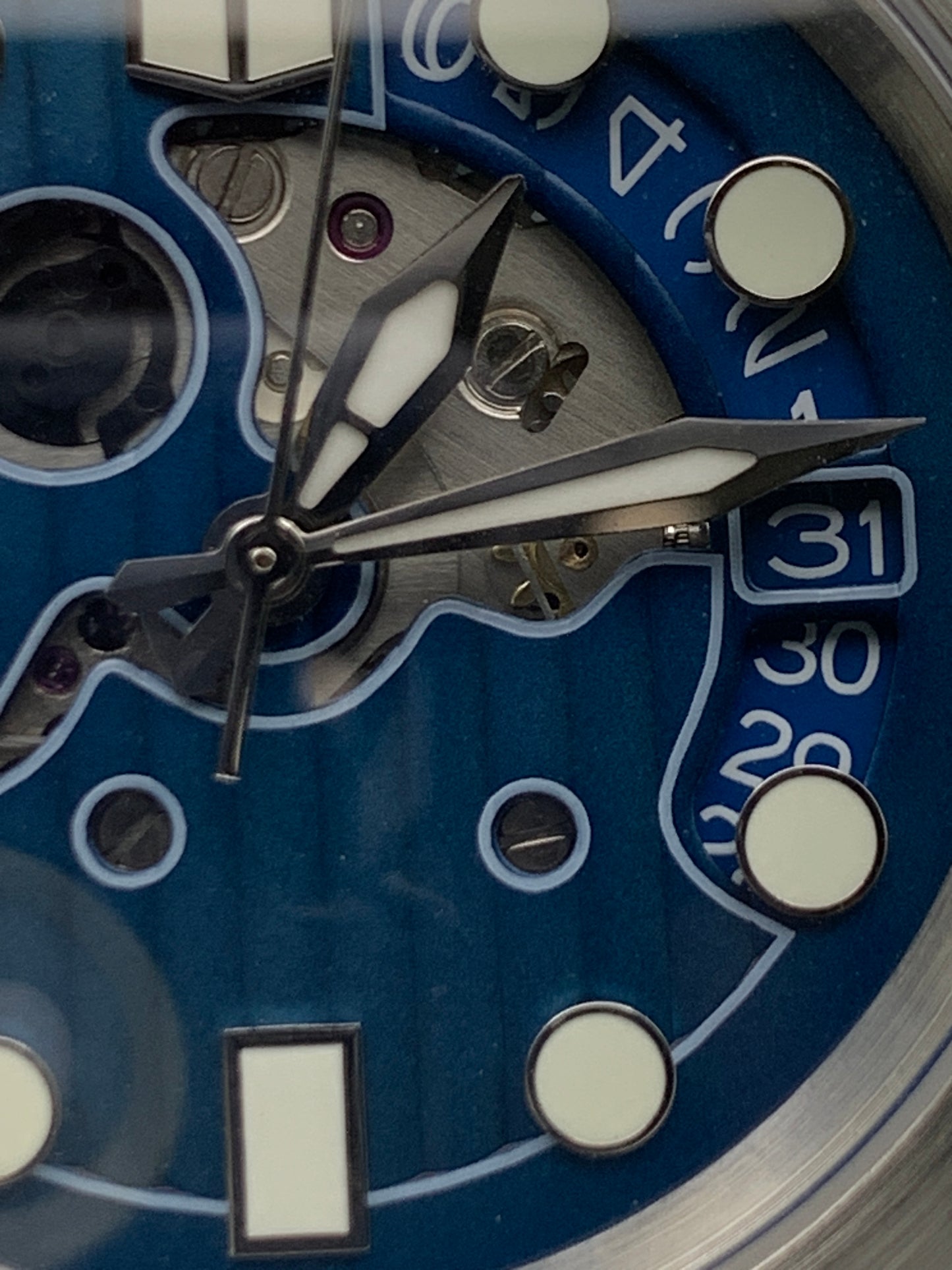 Wintermute. 39mm brushed stainless steel case. Domed sapphire crystal. Seiko NH35 with blue date wheel.