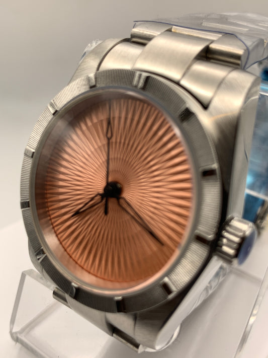 Sunbeam. 39mm stainless steel case and matching bracelet. Textured dial and unique handset. Sapphire crystal. NH38 automatic movement.