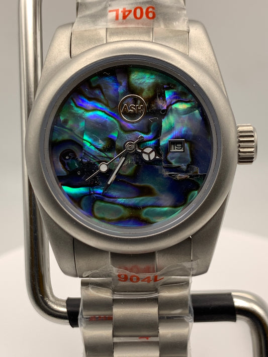 Microcosm. 31mm Brushed stainless steel with matching bracelet. Sapphire crystal. Seiko NH05 automatic.