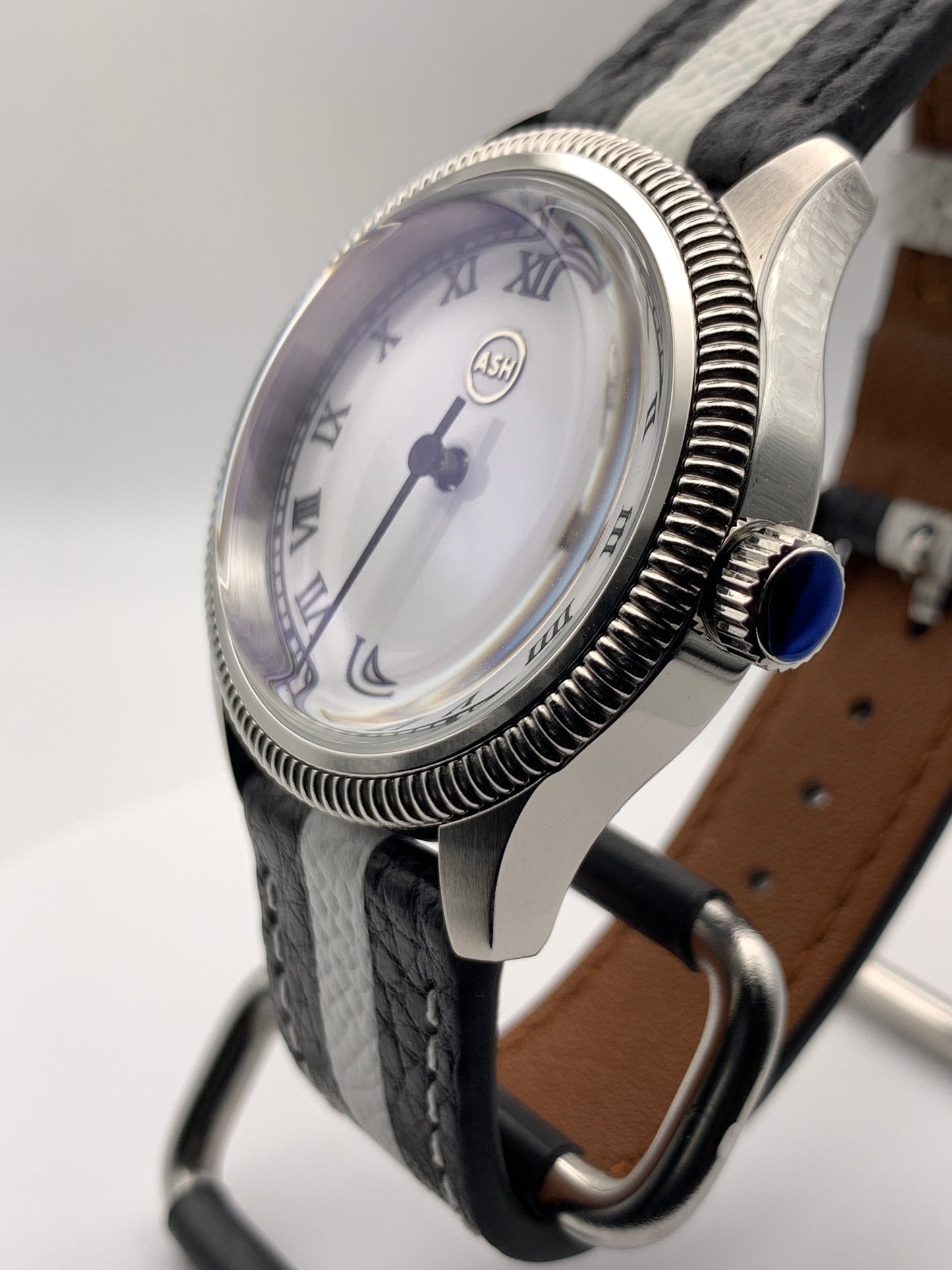 Thereabouts - One hand watch. 38mm coin edged stainless steel case. Enamel dial. Boxed K-1 crystal. Exhibition case back with blue custom rotor. Seiko NH38.