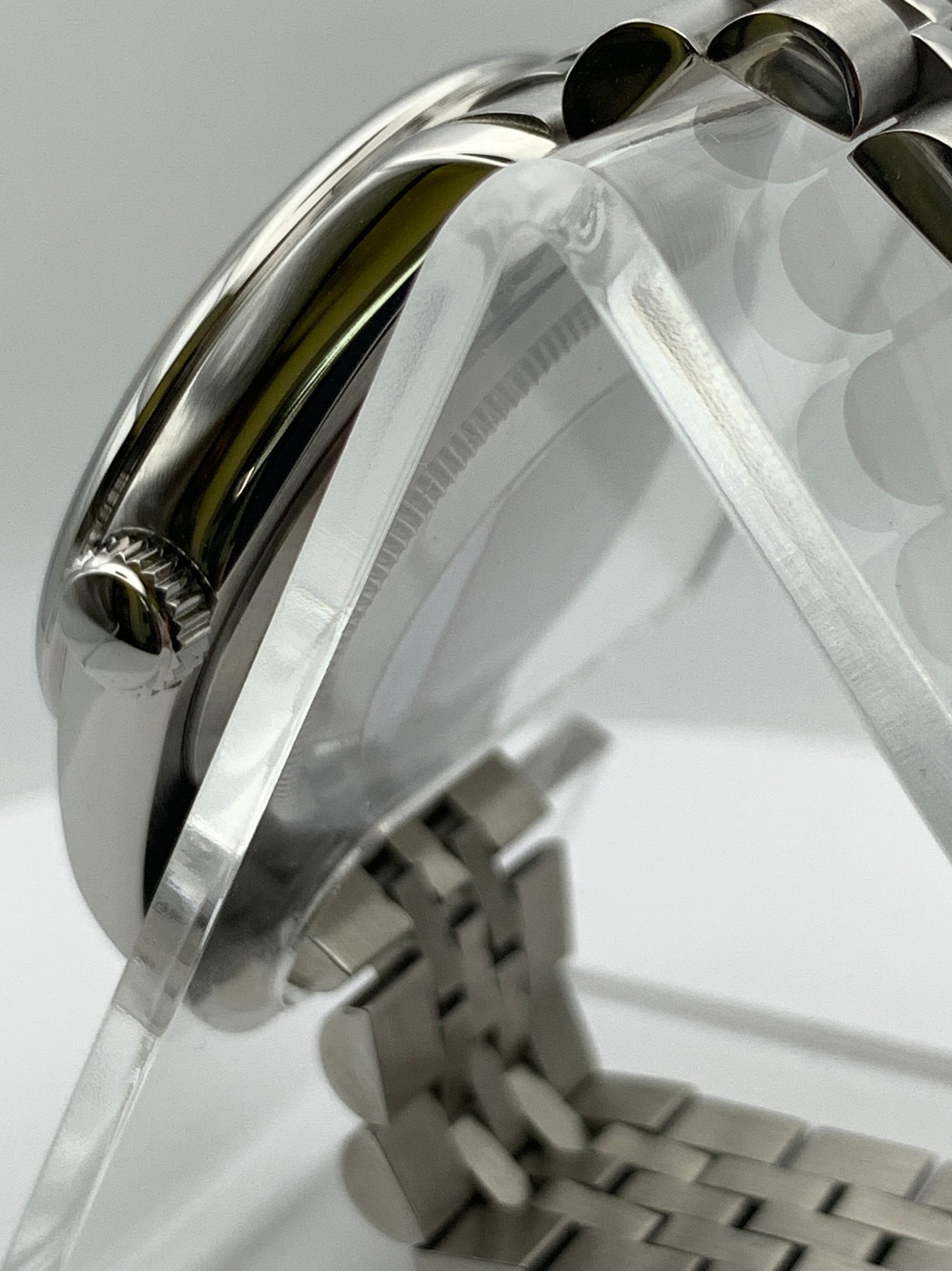 Pale yellow 36mm sport watch on bracelet.
