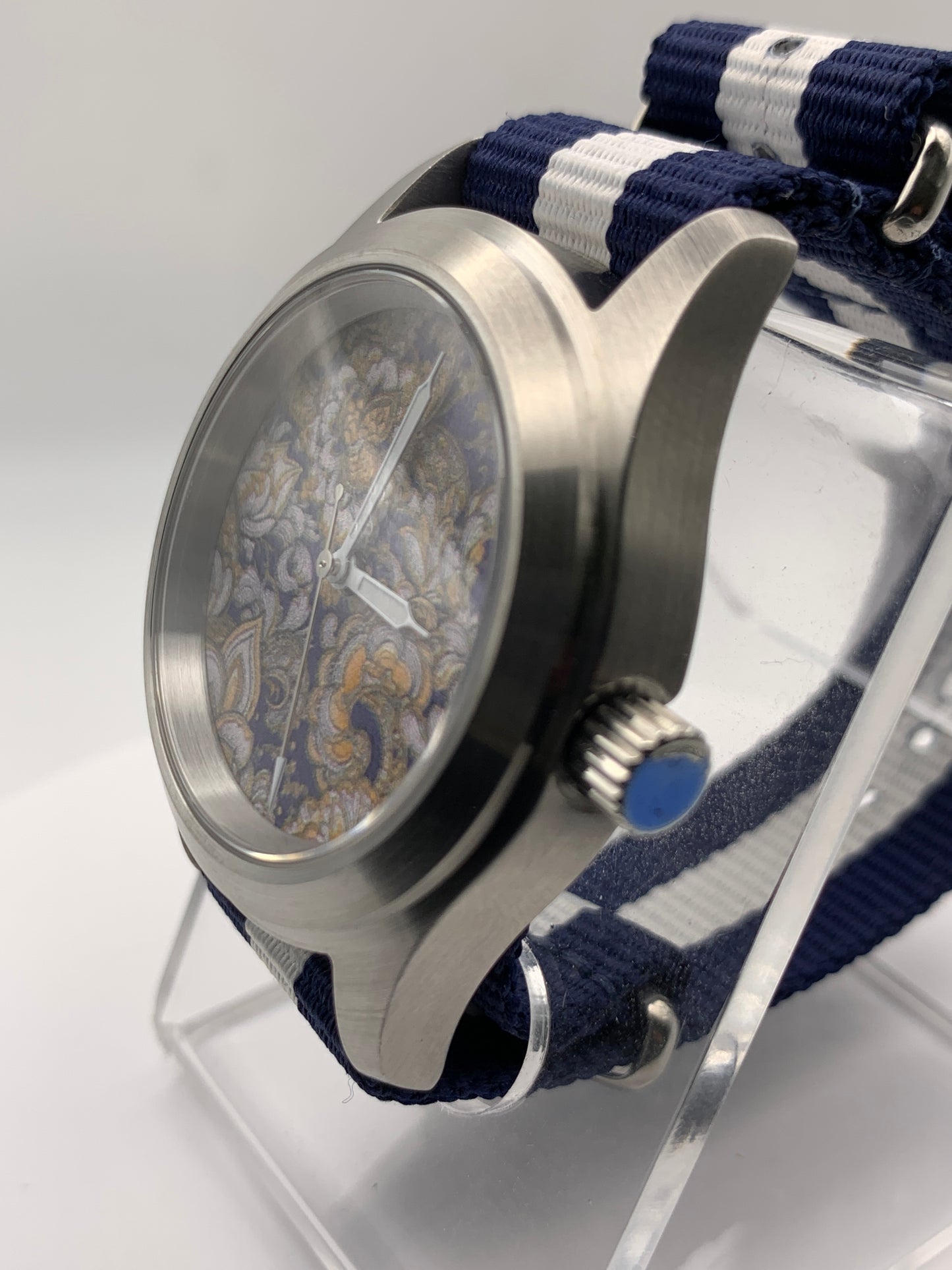 Cloth & Steel. 38mm brushed stainless steel. Ornate dial. Sapphire crystal. Seiko NH38