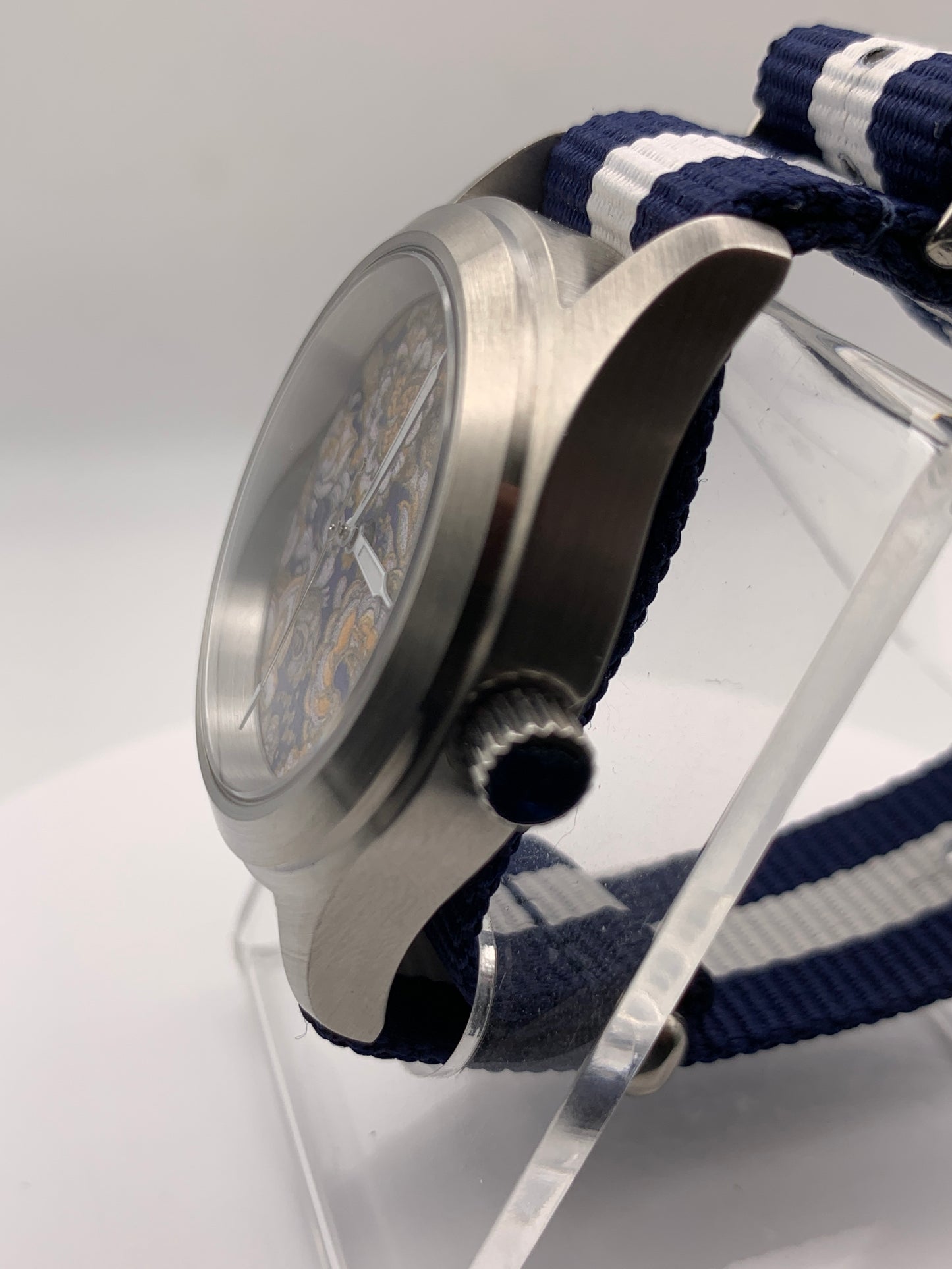 Cloth & Steel. 38mm brushed stainless steel. Ornate dial. Sapphire crystal. Seiko NH38