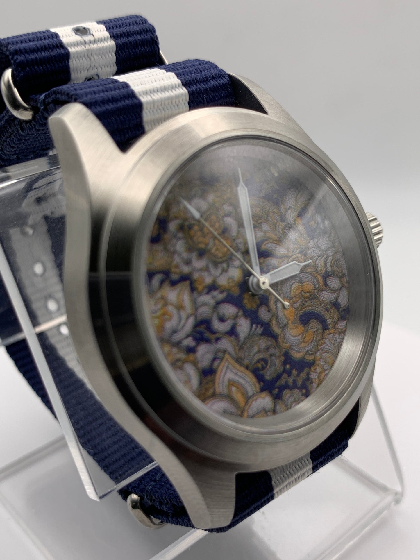 Cloth & Steel. 38mm brushed stainless steel. Ornate dial. Sapphire crystal. Seiko NH38