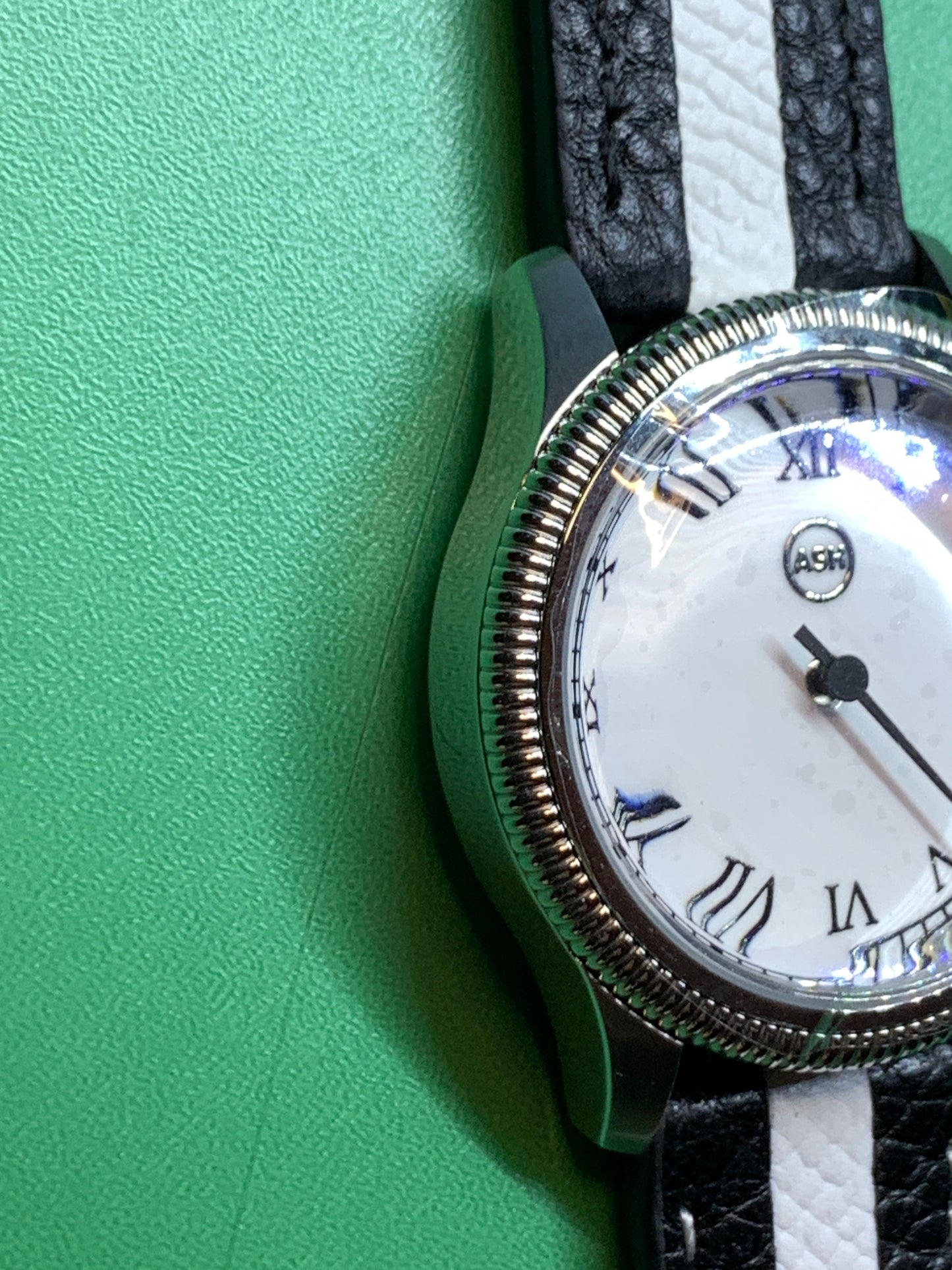 Thereabouts - One hand watch. 38mm coin edged stainless steel case. Enamel dial. Boxed K-1 crystal. Exhibition case back with blue custom rotor. Seiko NH38.
