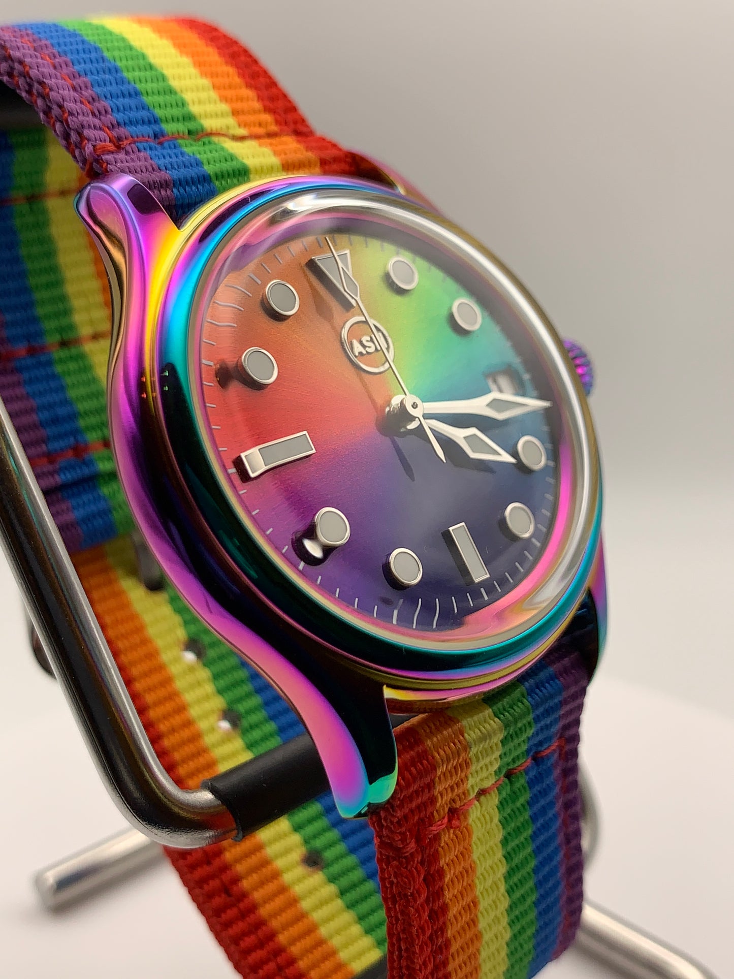 Portable rainbow. 38mm thermally colored stainless steel case and case back. Double dome K-1 mineral crystal. Seiko NH35.