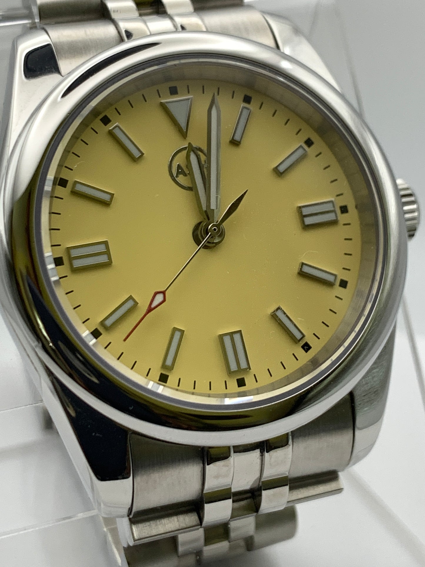Pale yellow 36mm sport watch on bracelet.