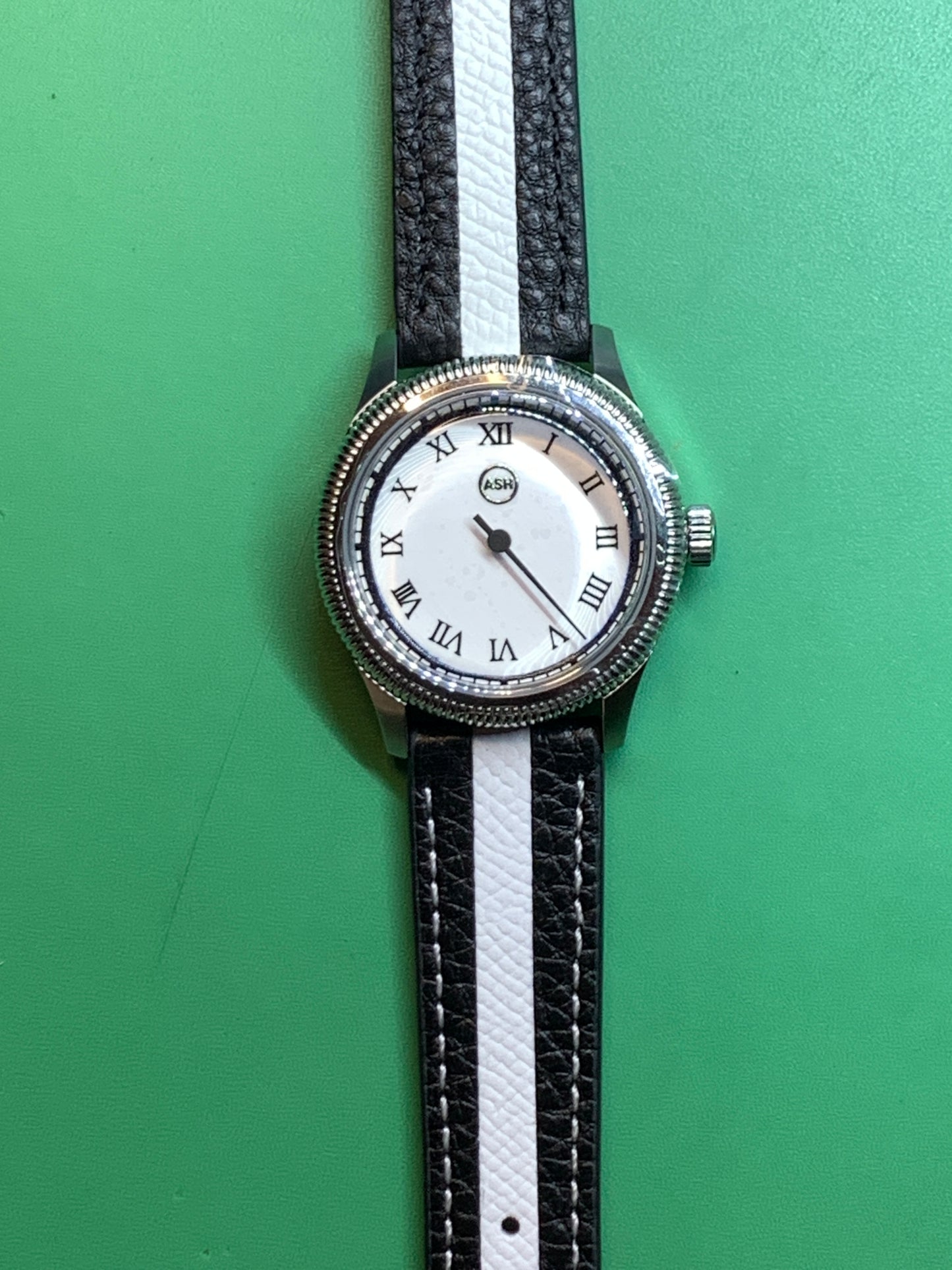 Thereabouts - One hand watch. 38mm coin edged stainless steel case. Enamel dial. Boxed K-1 crystal. Exhibition case back with blue custom rotor. Seiko NH38.