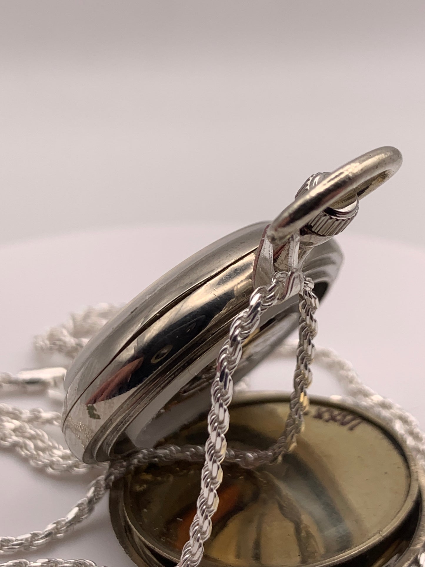 Amuse-bouche Deux. 30mm NOS Argentan alloy pocket / necklace watch. On a 24” 1.5mm sterling silver chain. Sapphire crystal. Vintage hand painted enamel dial. Miyota 2036.