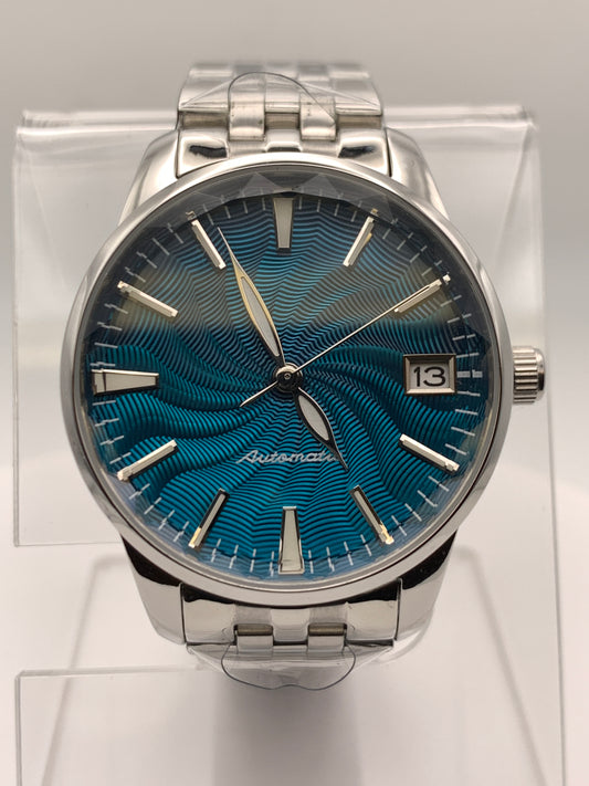 The Teal. Highly figured dress watch. 33mm stainless steel case. Faceted and domed acrylic crystal. NH35.