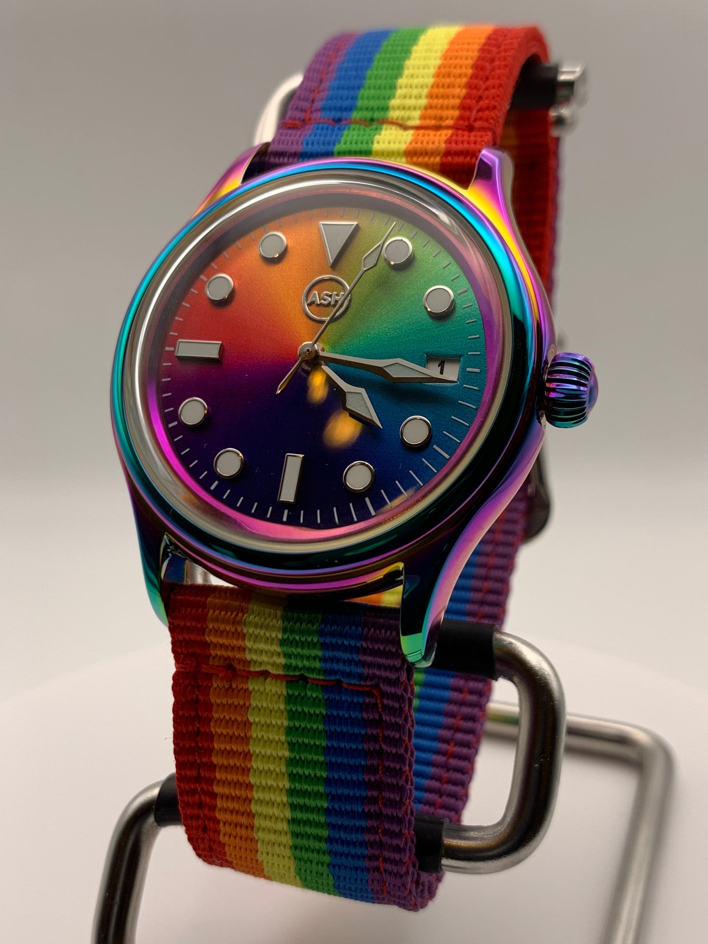 Portable rainbow. 38mm thermally colored stainless steel case and case back. Double dome K-1 mineral crystal. Seiko NH35.