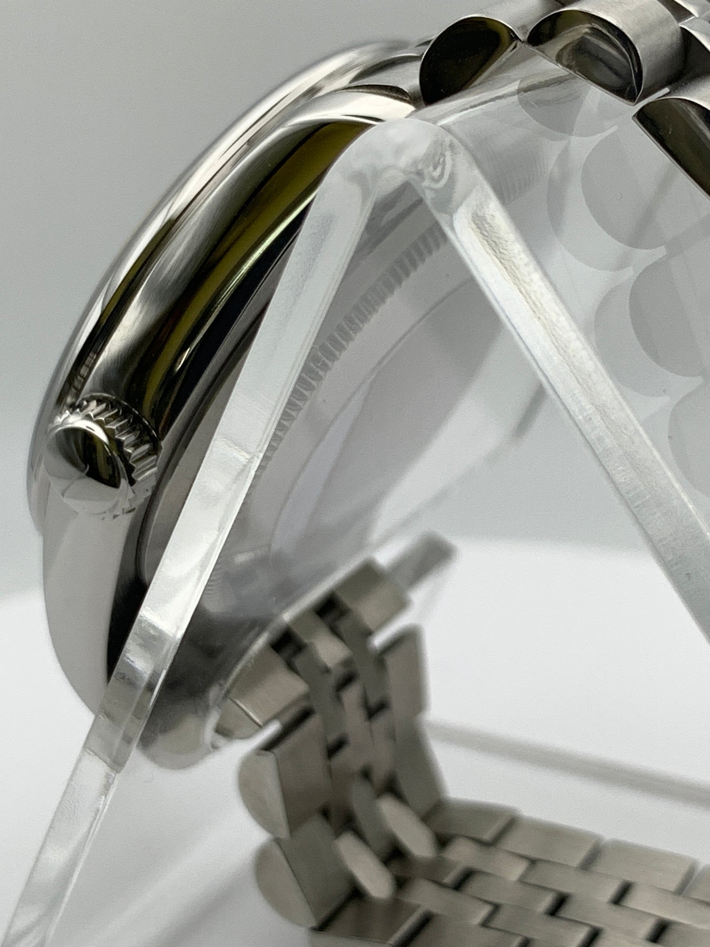 Pale yellow 36mm sport watch on bracelet.