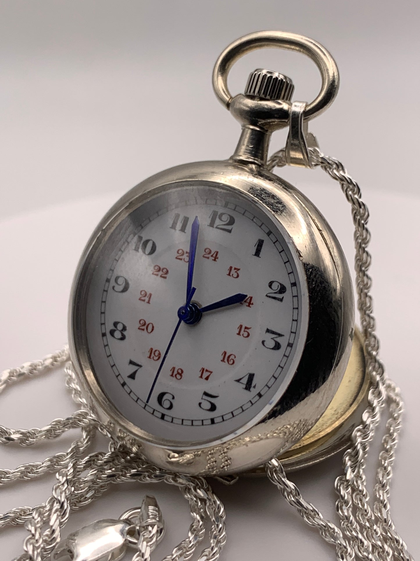 Amuse-bouche Deux. 30mm NOS Argentan alloy pocket / necklace watch. On a 24” 1.5mm sterling silver chain. Sapphire crystal. Vintage hand painted enamel dial. Miyota 2036.