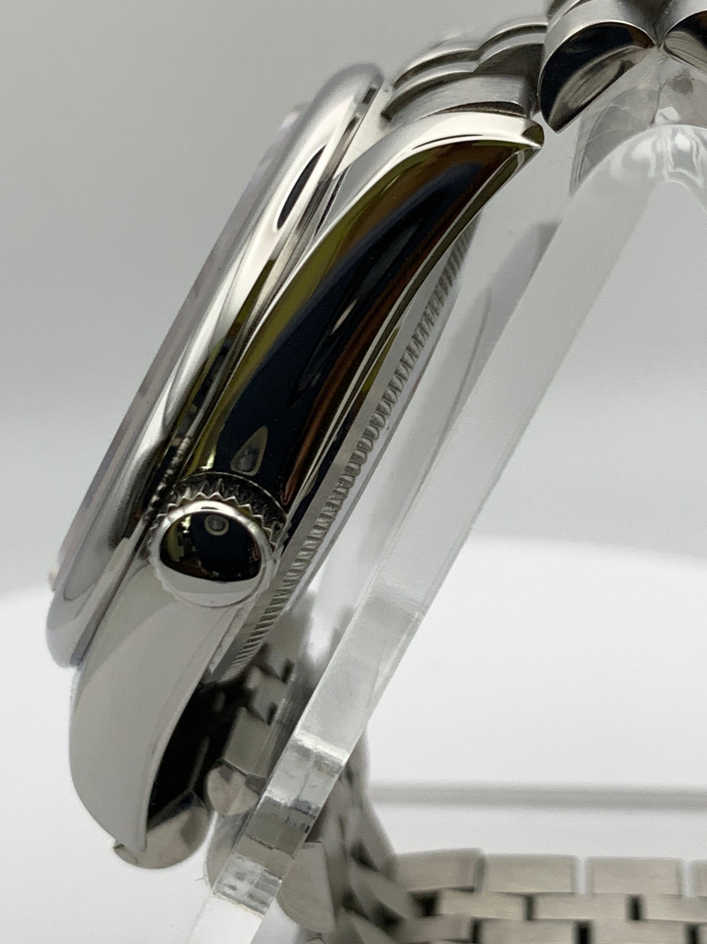 Pale yellow 36mm sport watch on bracelet.